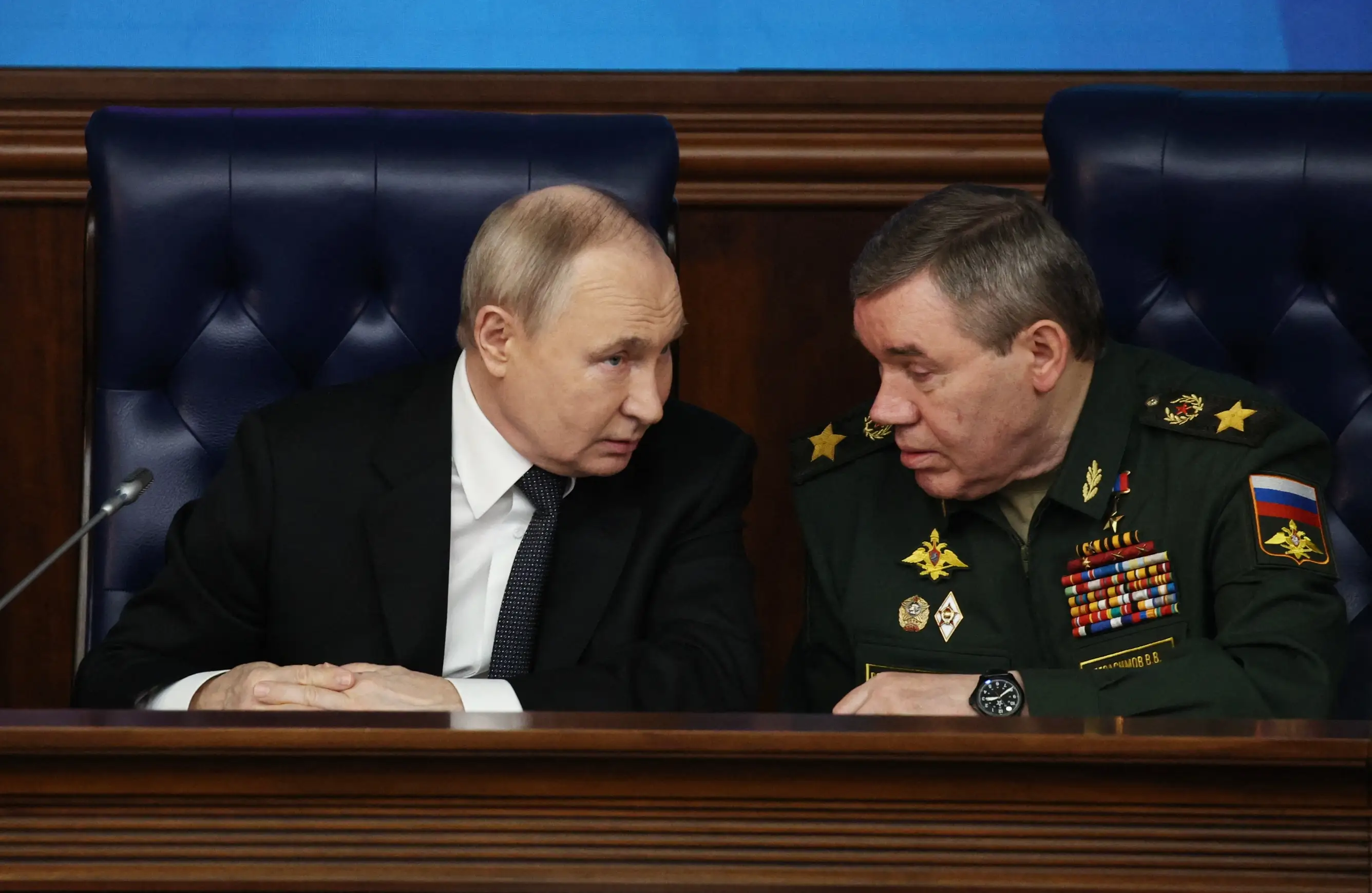 Russia's leader, Vladimir Putin, and Chief of the General Staff Valery Gerasimov attend an expanded meeting of the Russian Defence Ministry Board at the National Defence Control Centre in Moscow.