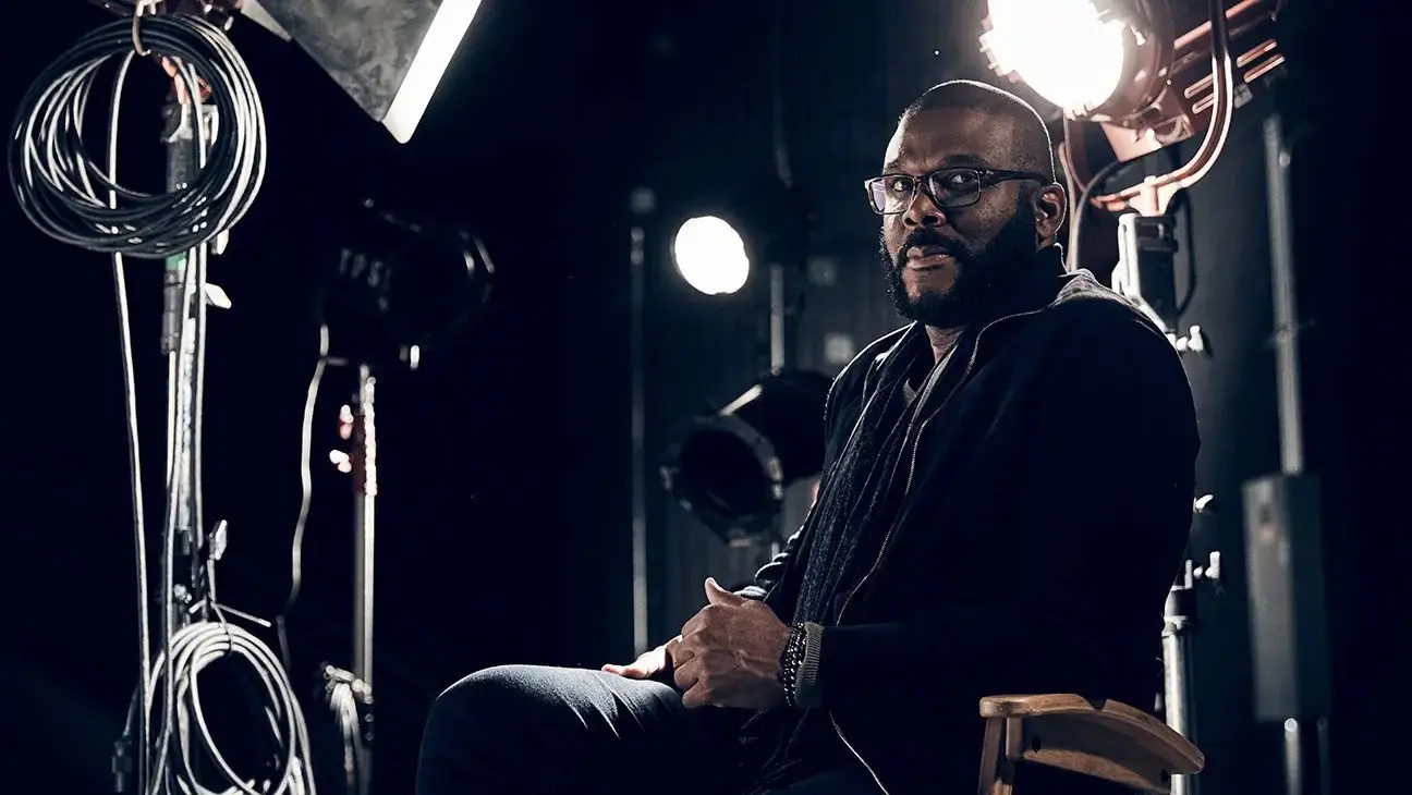 Tyler Perry sitting in a soundstage