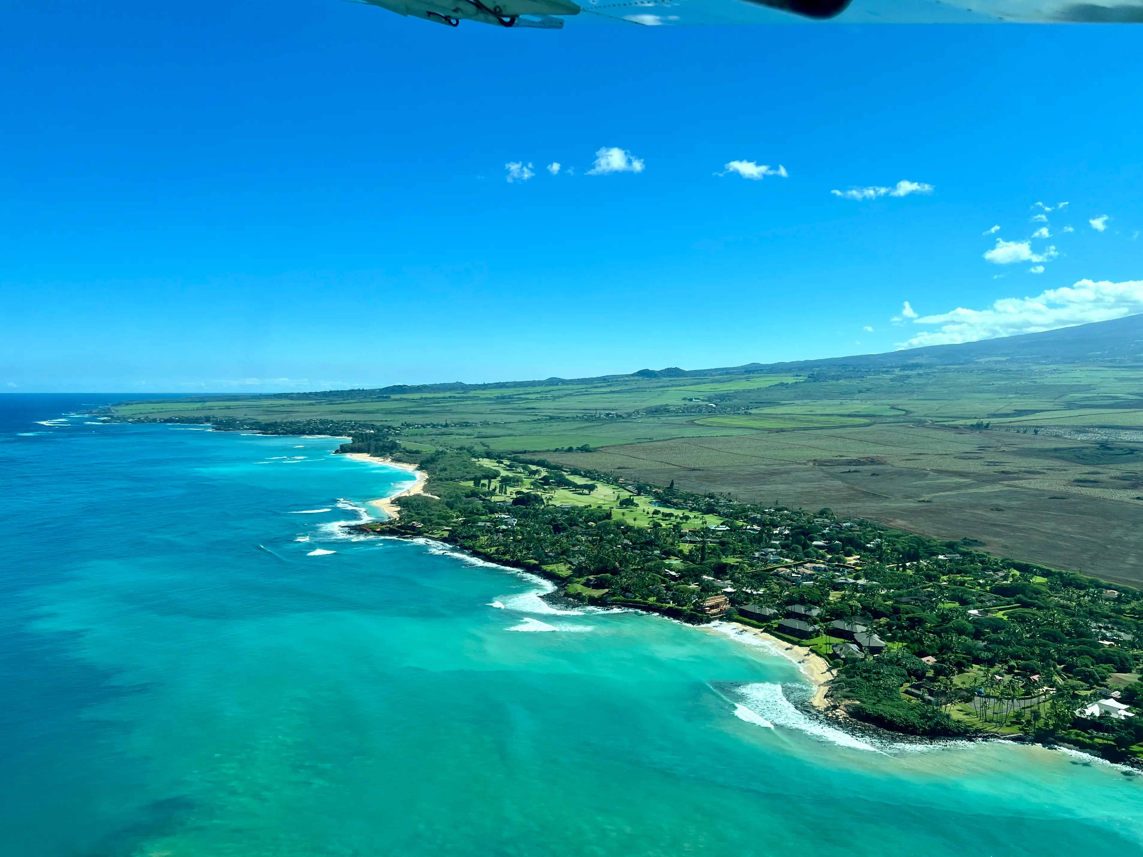 Aerial view of Maui's north shore from plane window