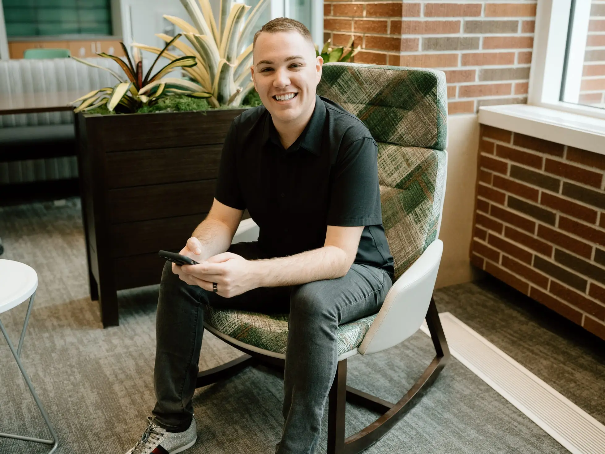 Kyle Elliott sitting in a chair.