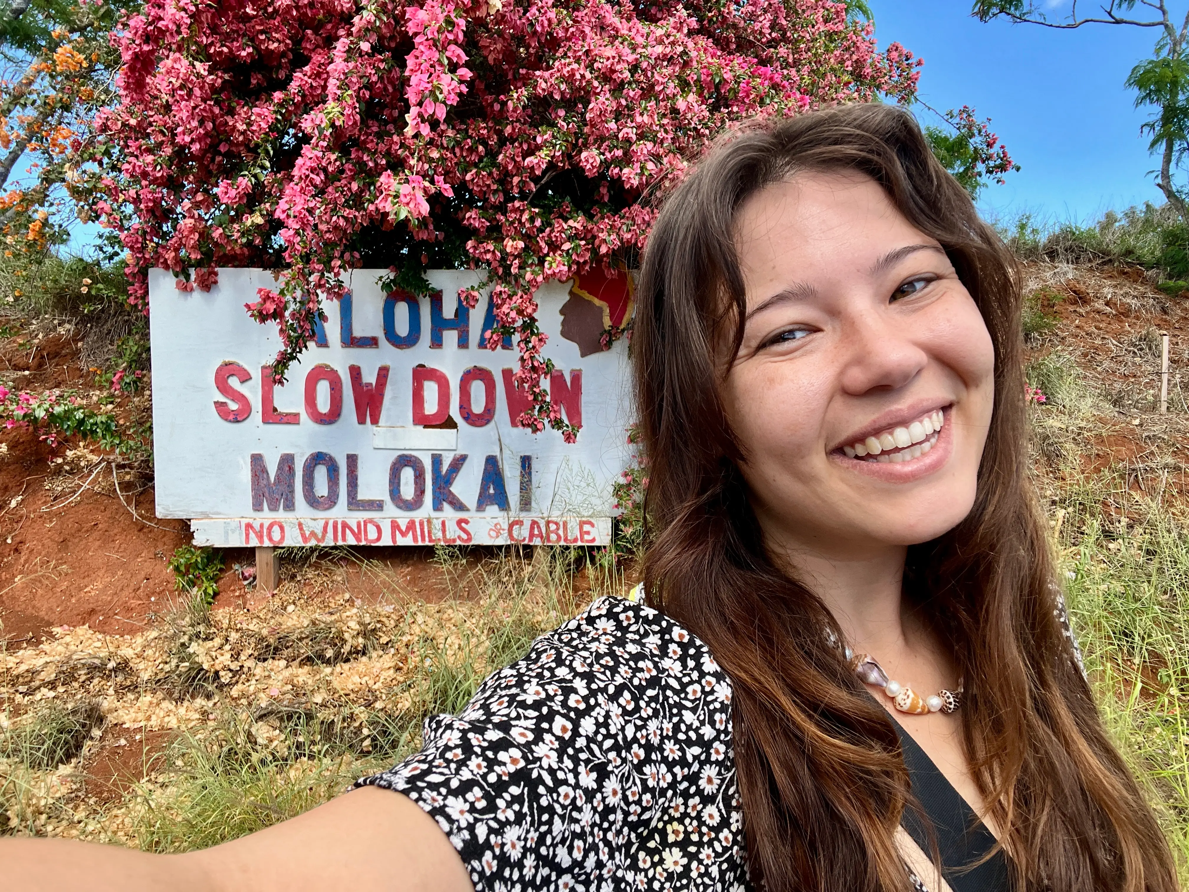 Author Ashley Probst smiling for selfie on front of