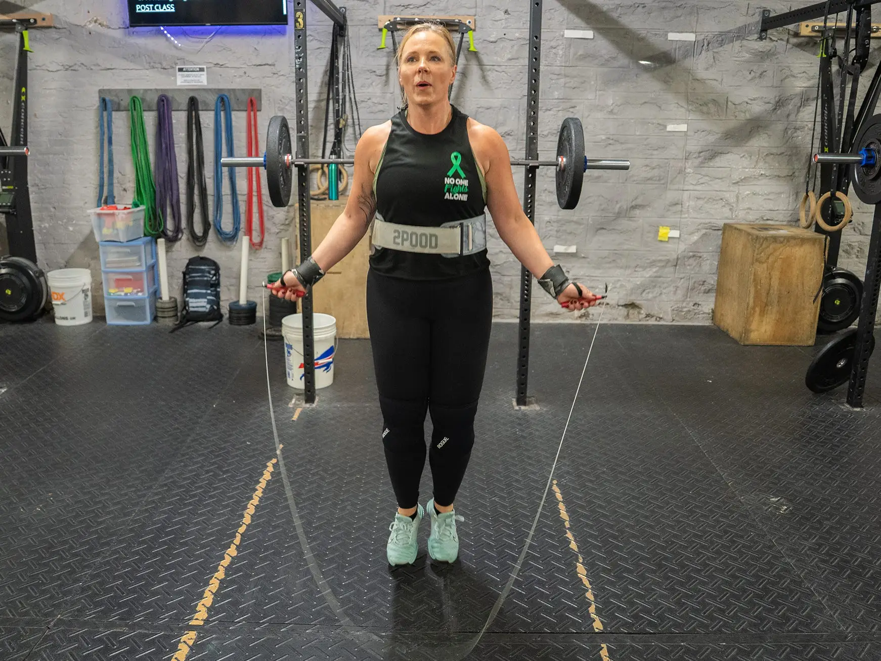 Dr. Shernan Holtan jumping rope at a CrossFit gym