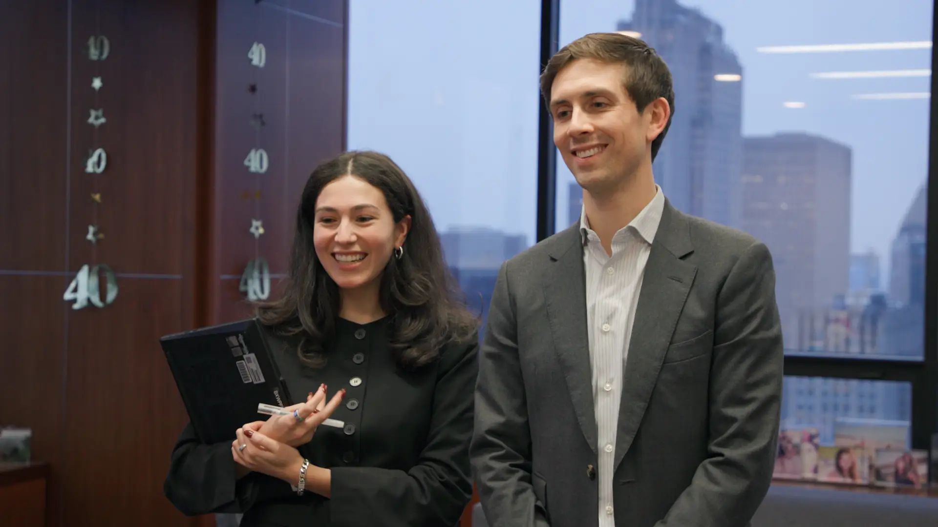 Mike Forman, Blackstone real estate's head of digital infrastructure, and an associate get the news that they will have to fire Ken Burns.