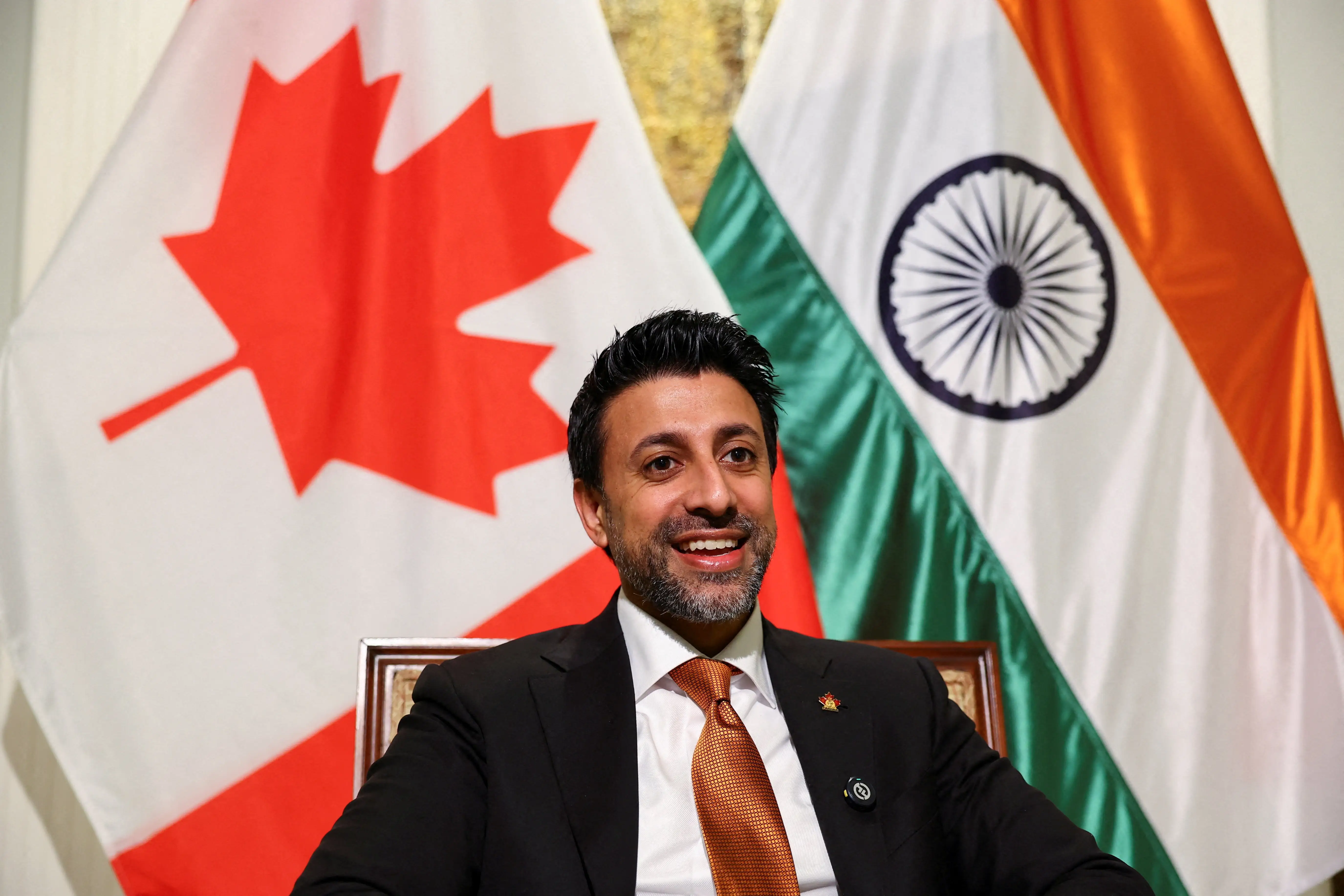 Canadian Minister of International Trade Maninder Sidhu reacts as he speaks during an interview with Reuters at the residence of the Canadian High Commissioner in New Delhi