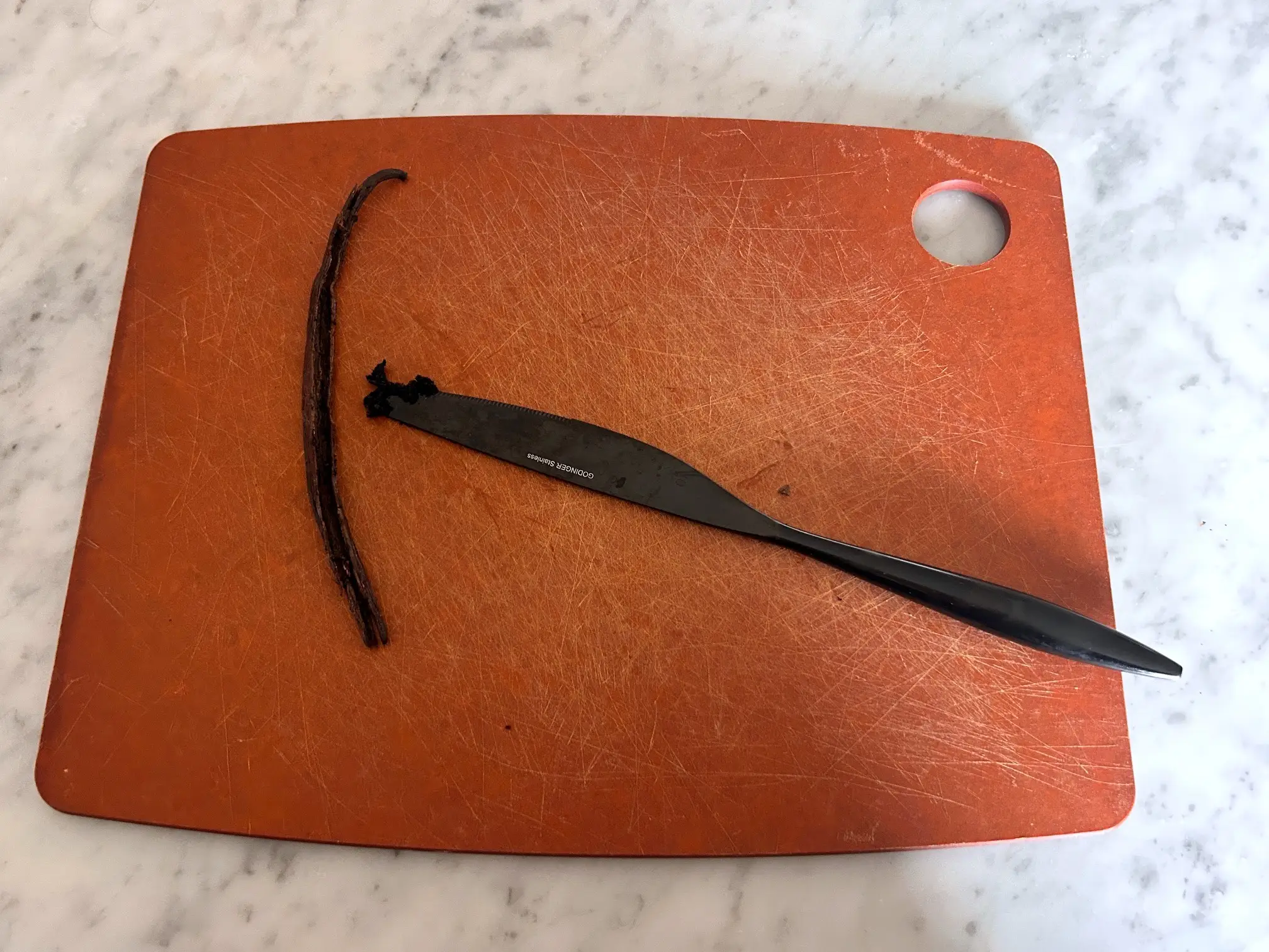 Scraping vanilla bean for Ina Garten's brownie pudding