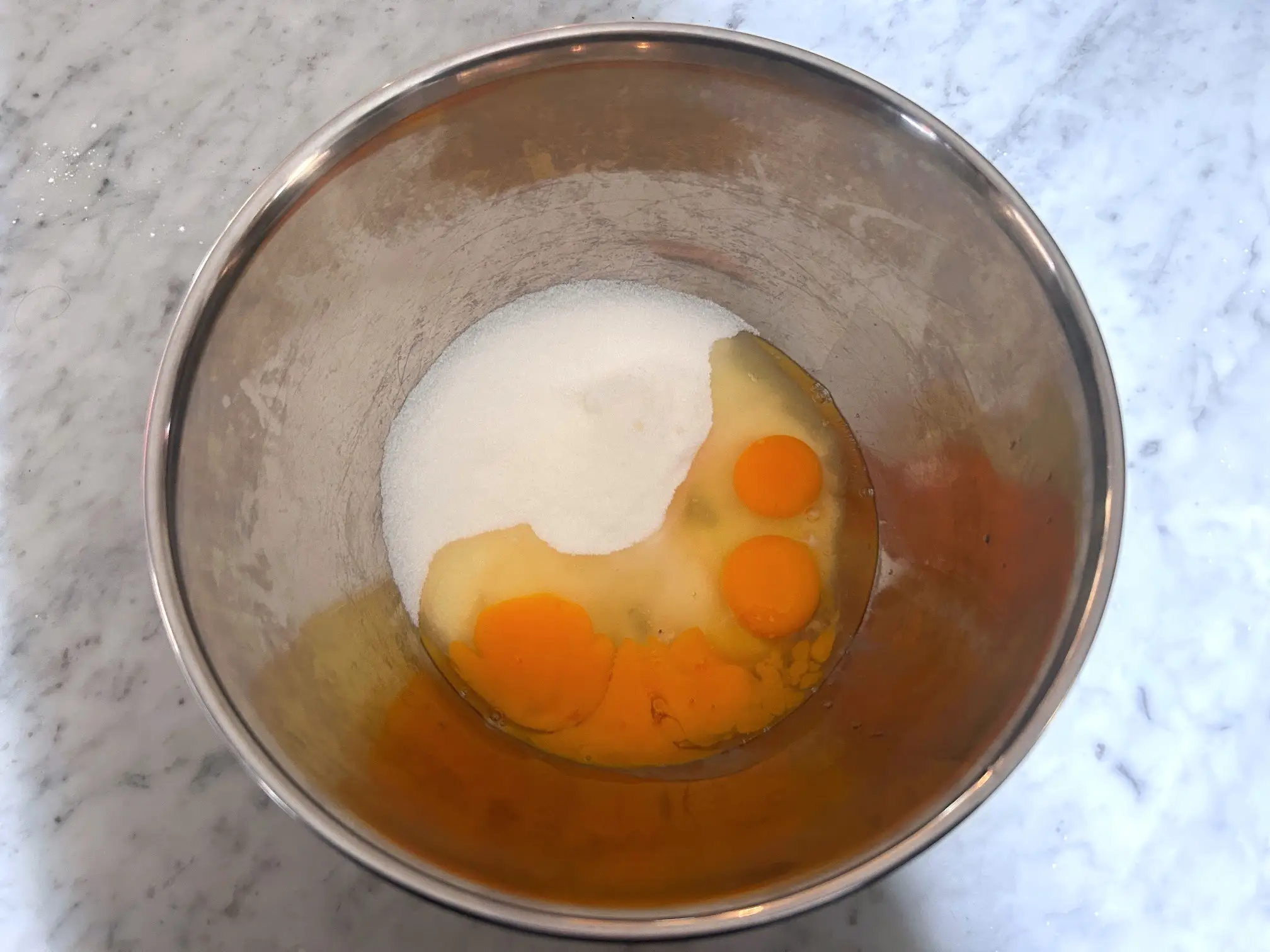 Mixing eggs with sugar for Ina Garten's brownie pudding
