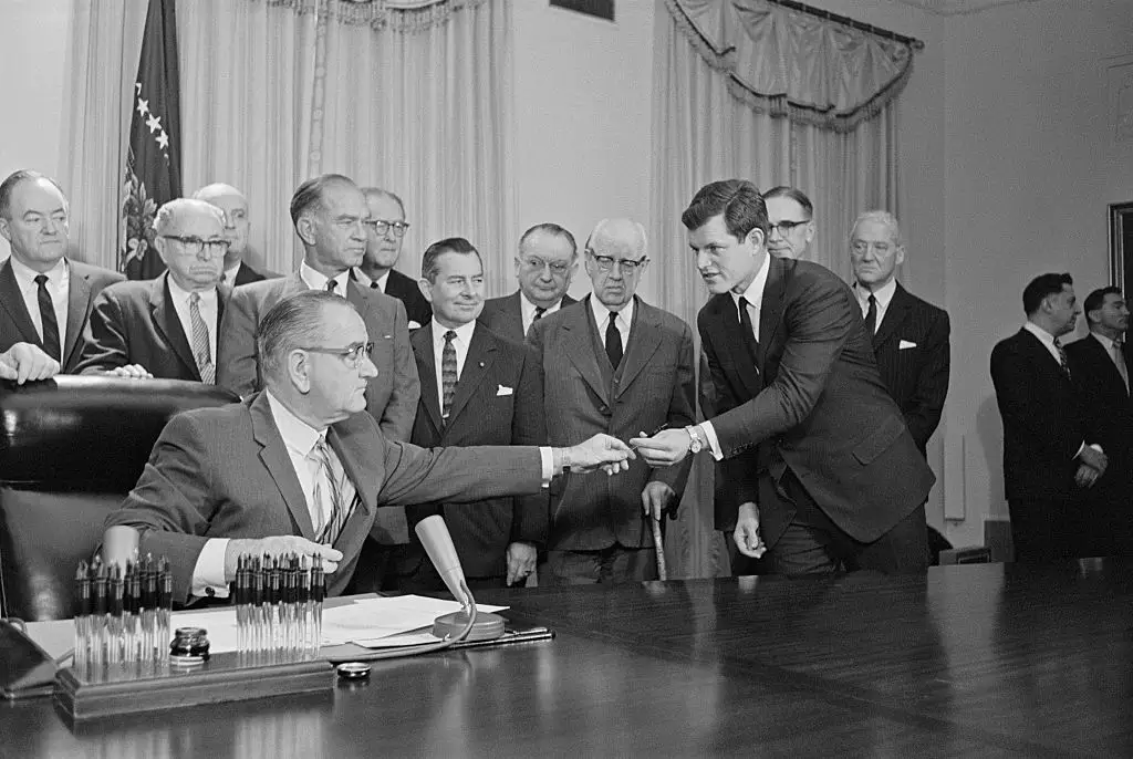 President Lyndon Johnson signed the bill renaming the National Cultural Center the John F. Kennedy Center for the Performing Arts and handed the pen to Edward Kennedy, the late president's brother.