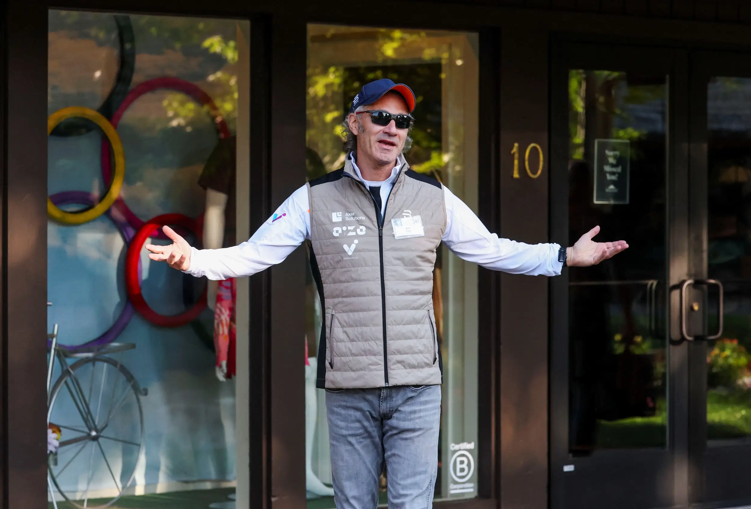 Alex Karp gestures to reporters during the 2025 Sun Valley Media and Technology Conference