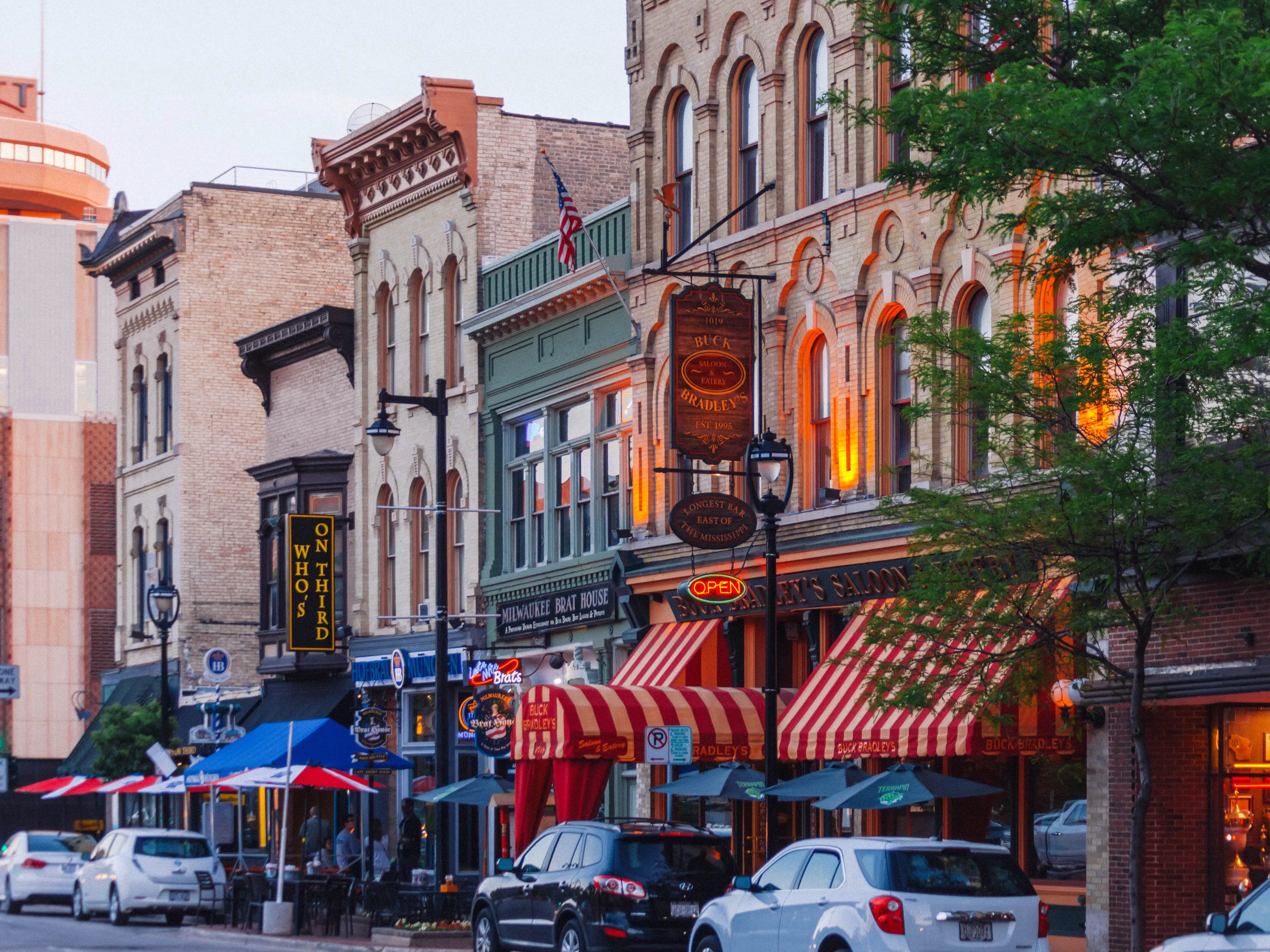 A street in Milwaukee with a tree.
