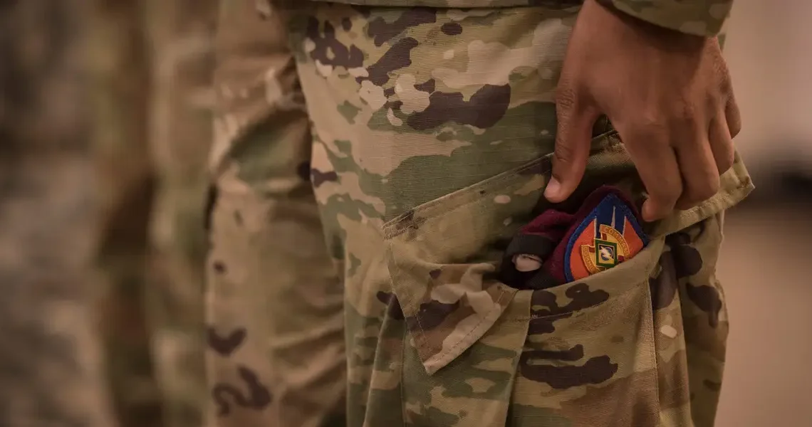 The US military is weird about hands in pockets, and the rules are all over the place
