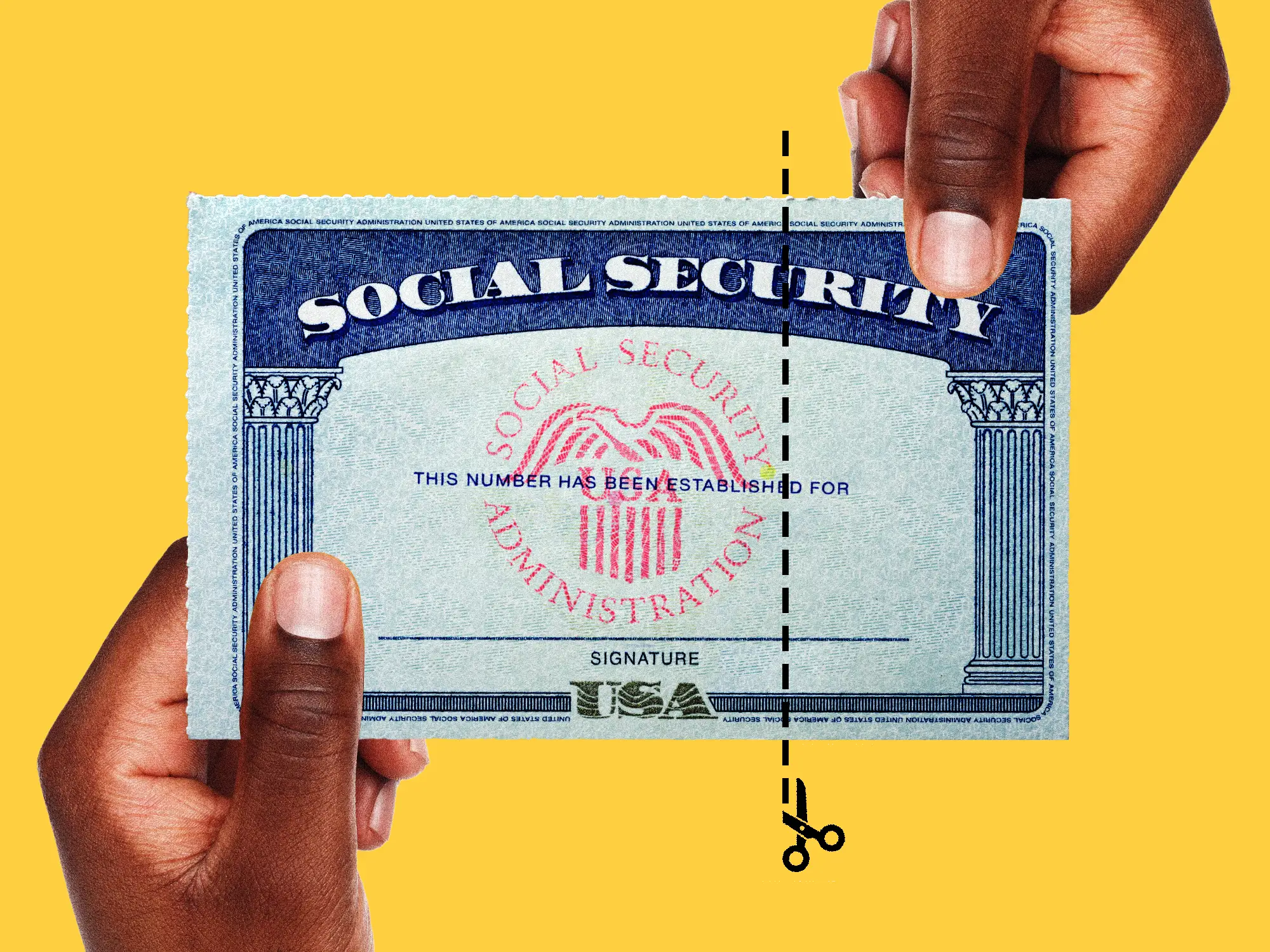 Two hands holding a social security card and a cut line going through it