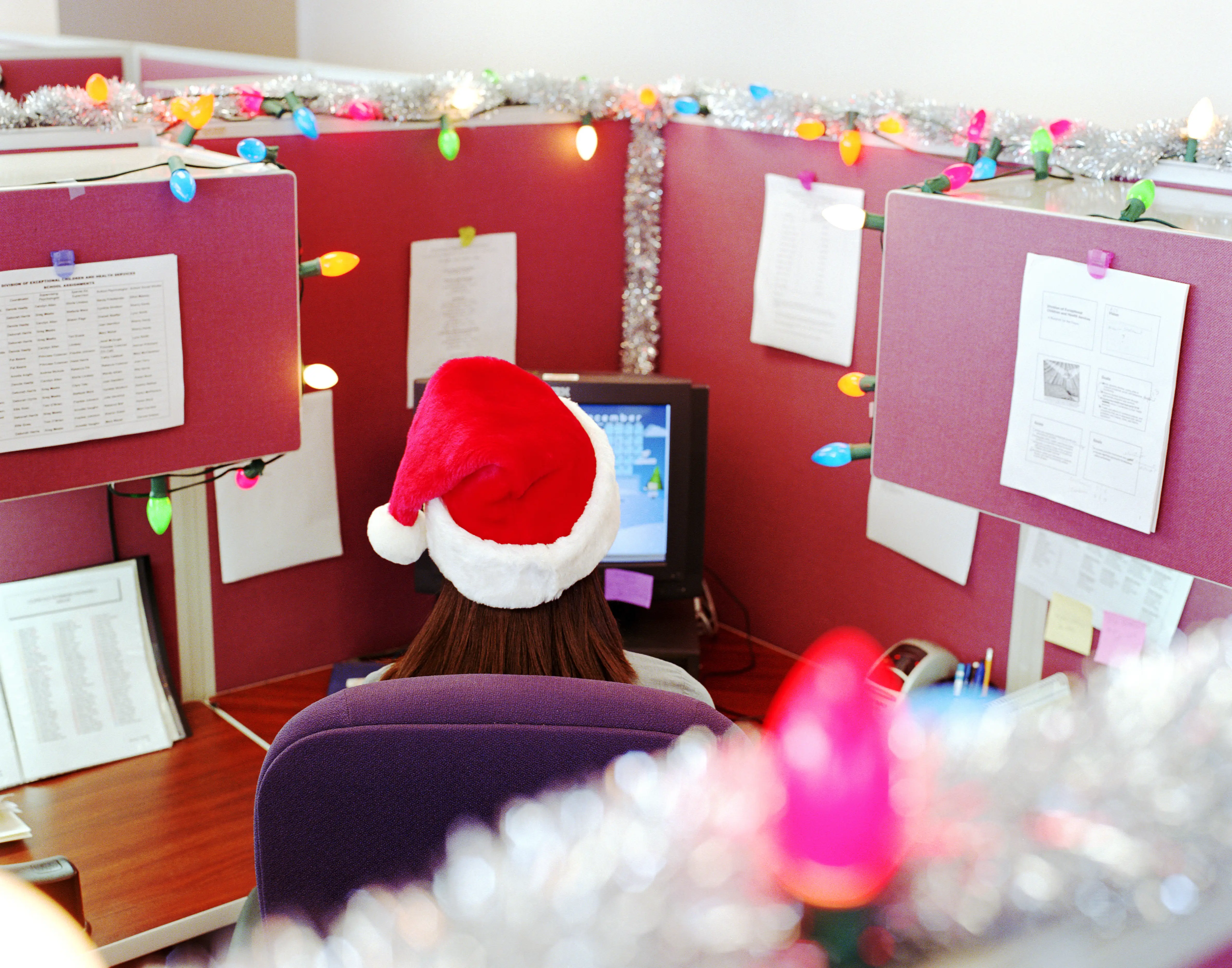 Person working in a cubicle during the holidays