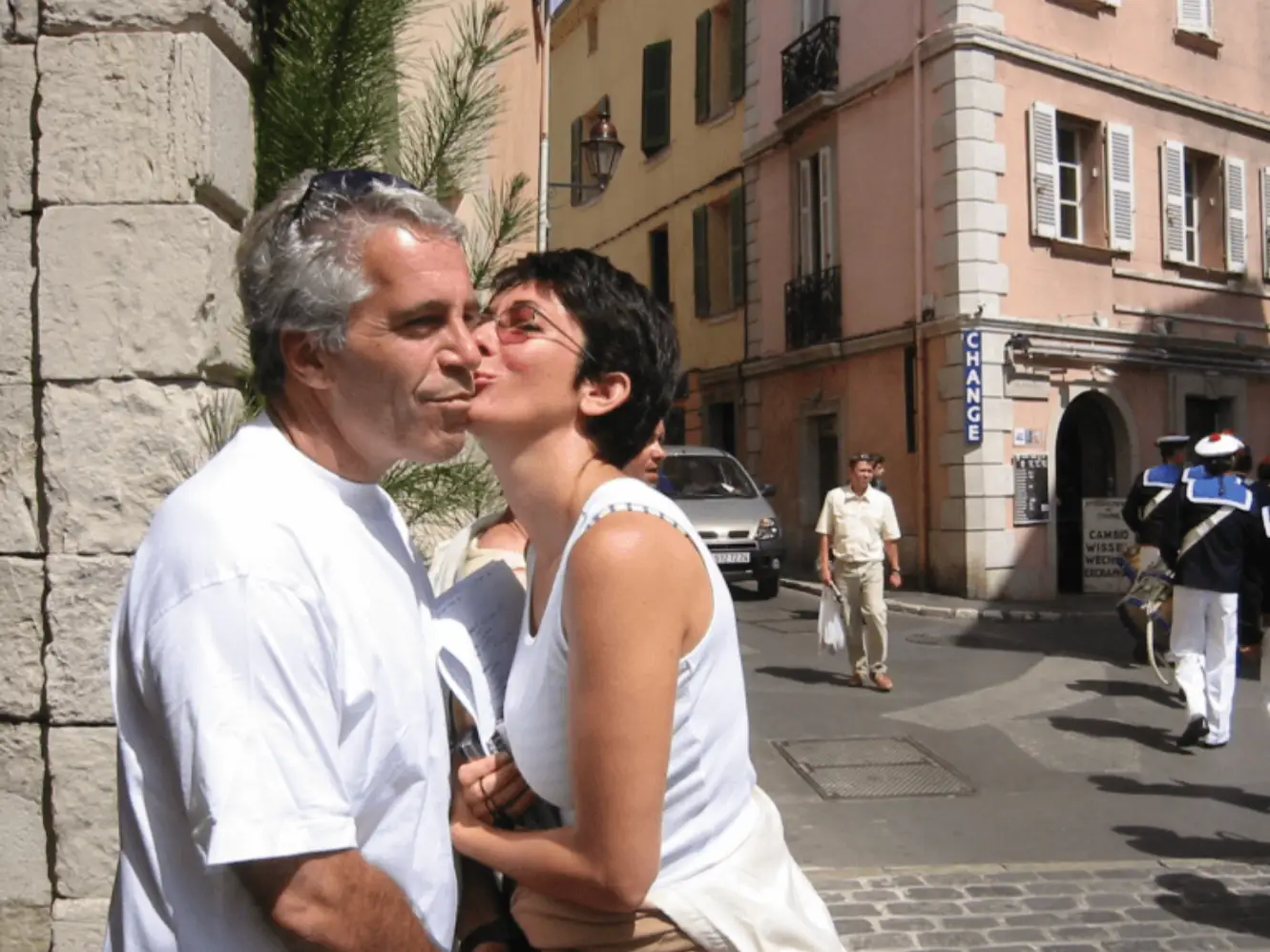 Jeffrey Epstein in a white T-shirt with Ghislaine Maxwell in white tank top.