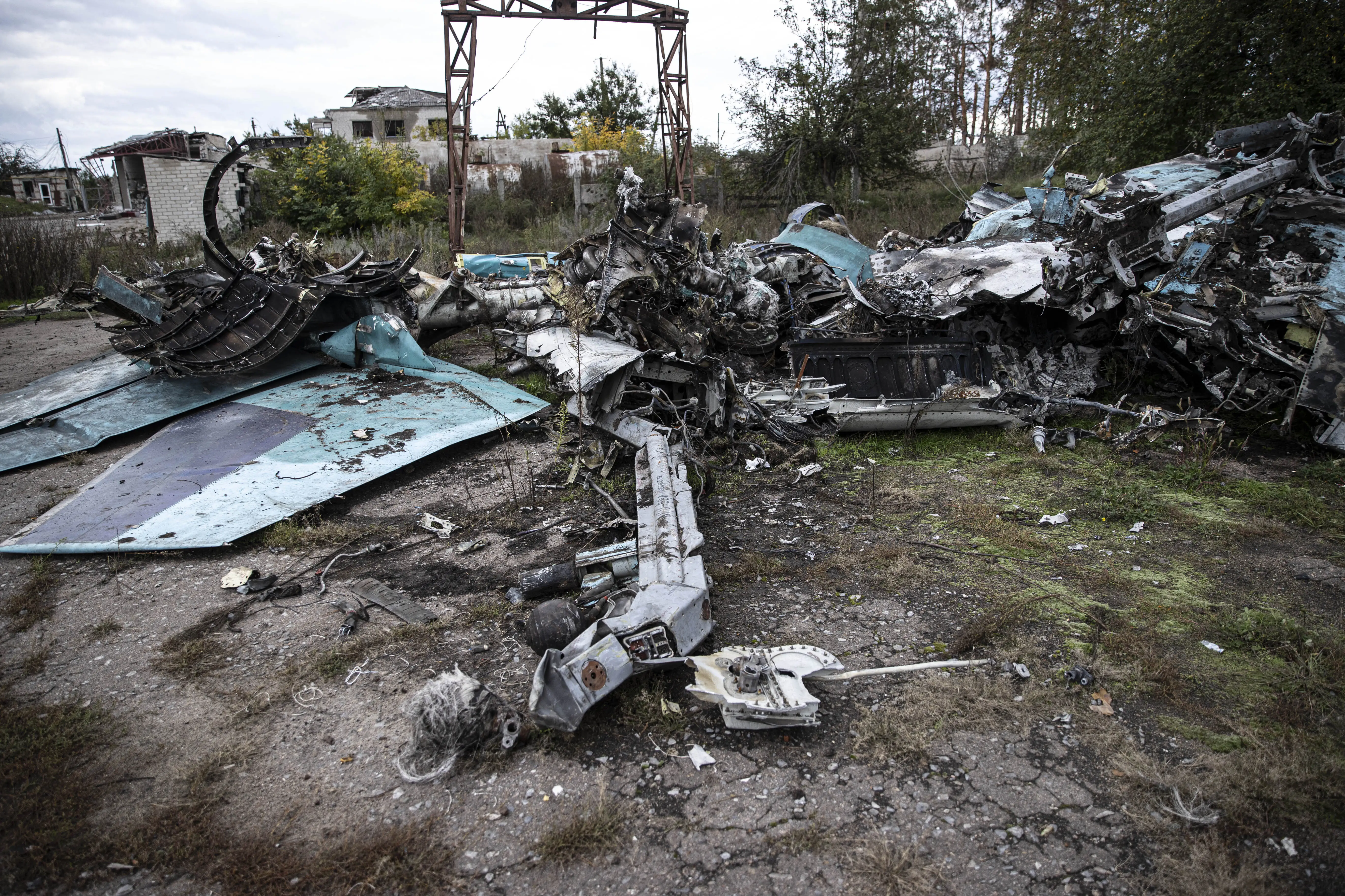 Burned and mangled remains of a jet on the ground
