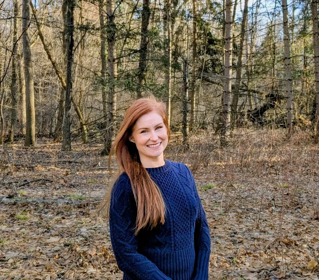 Aurora Bryant in front of some trees