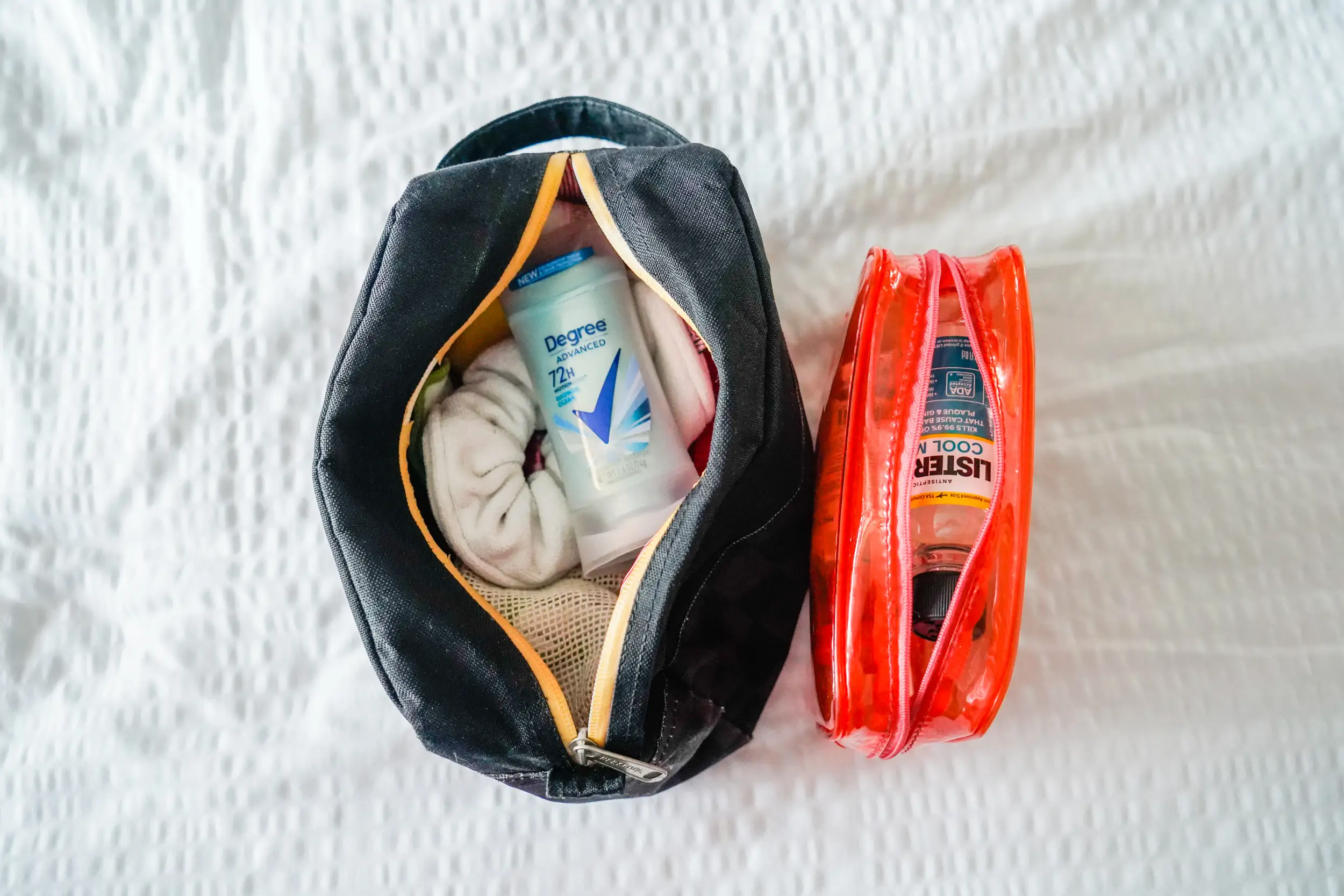 The author's packed toiletries on a white background
