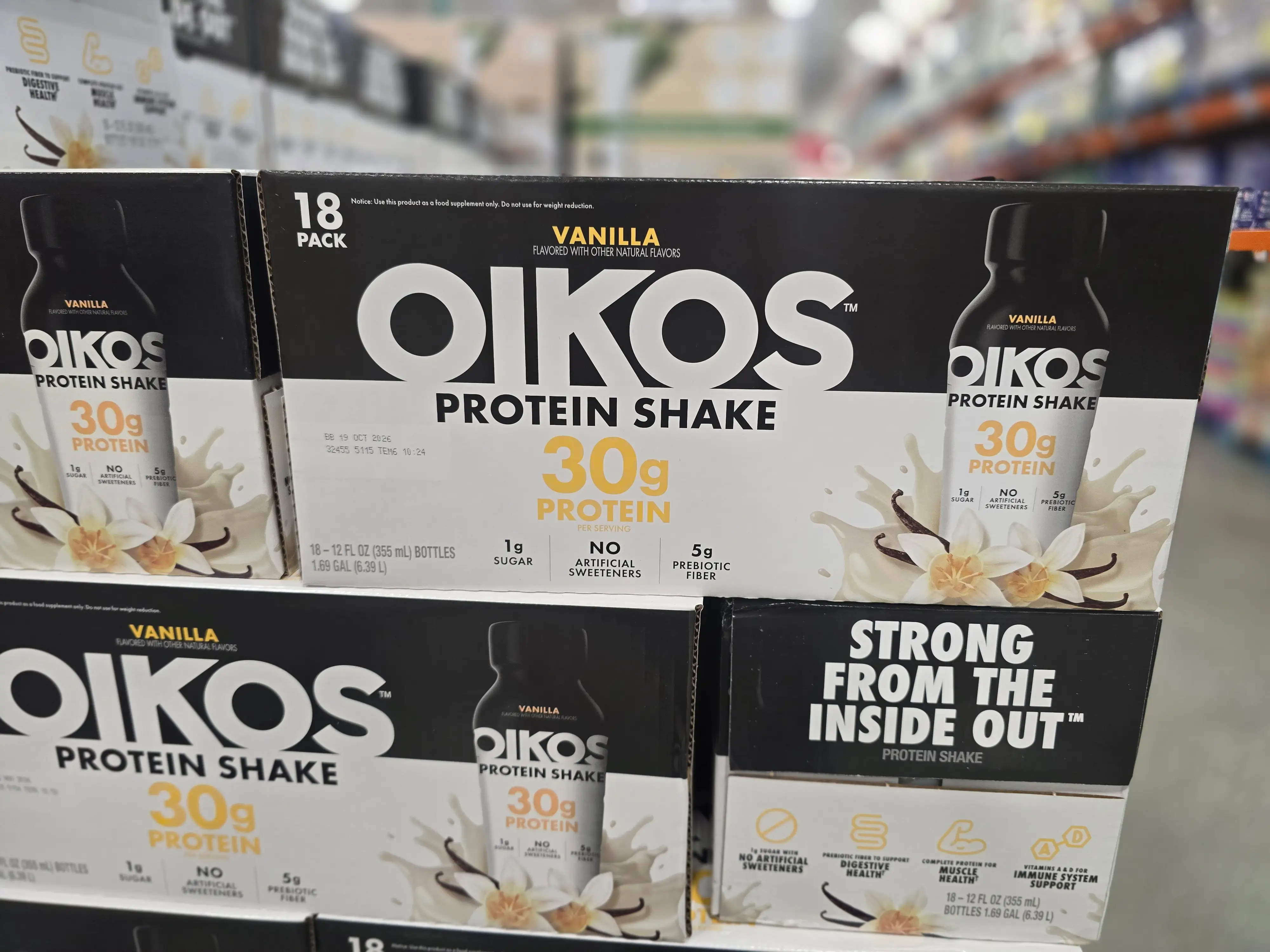 Boxes of Oikos vanilla protein shakes.