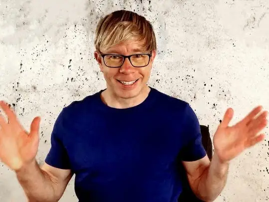 Headshot of Tim Schultz, white man in glasses with blonde hair
