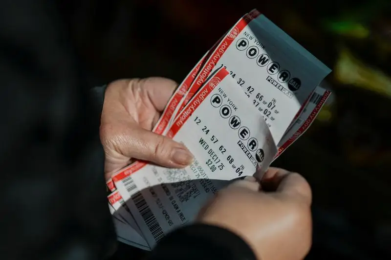 A person holds tickets for the $1.25 billion jackpot in the Powerball lottery drawing in New York City, U.S. December 17, 2025. REUTERS/Eduardo Munoz