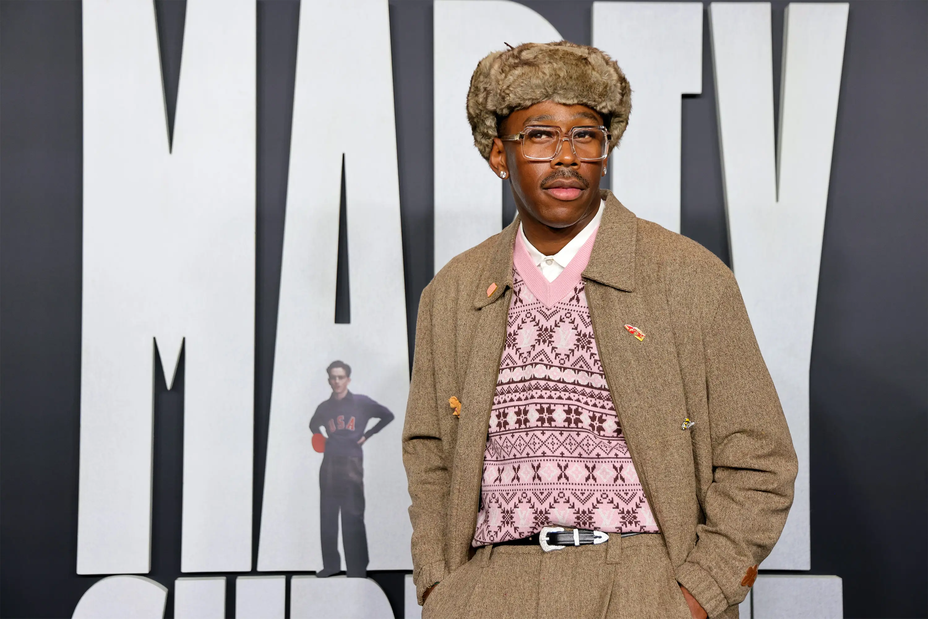 Tyler the Creator in a grey outfit