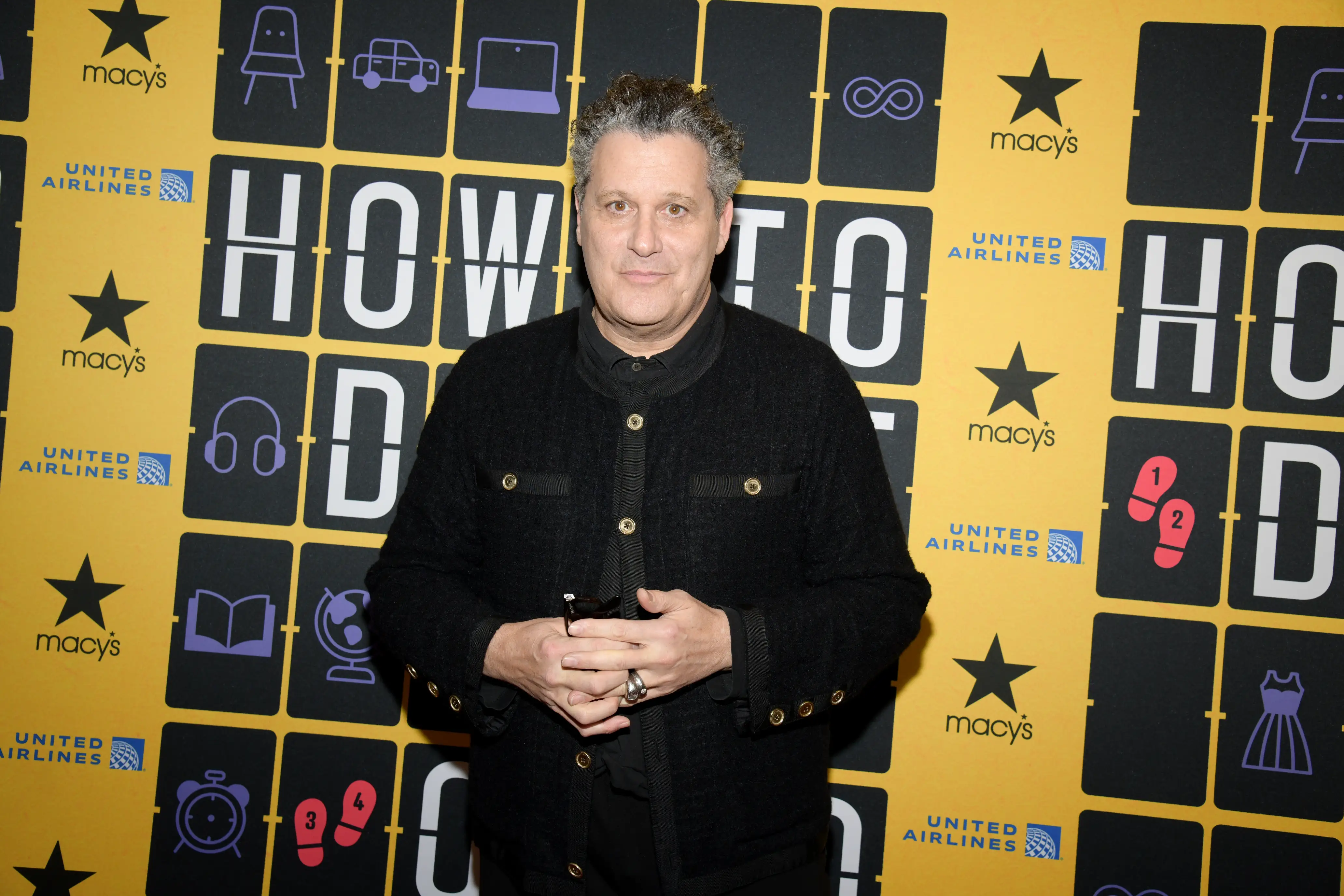 Isaac Mizrahi wearing a black jacket