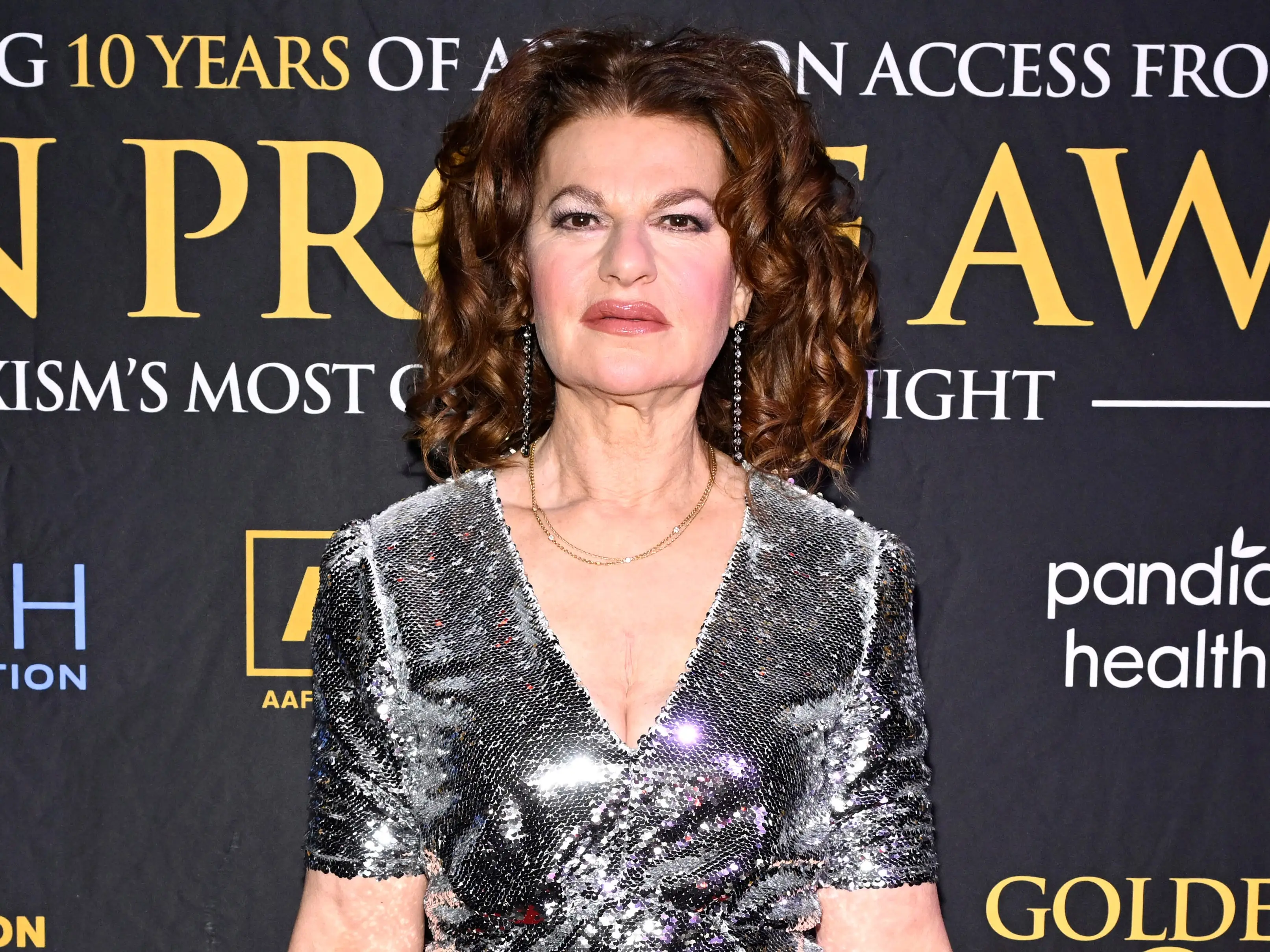 Sandra Bernhard in a silver dress
