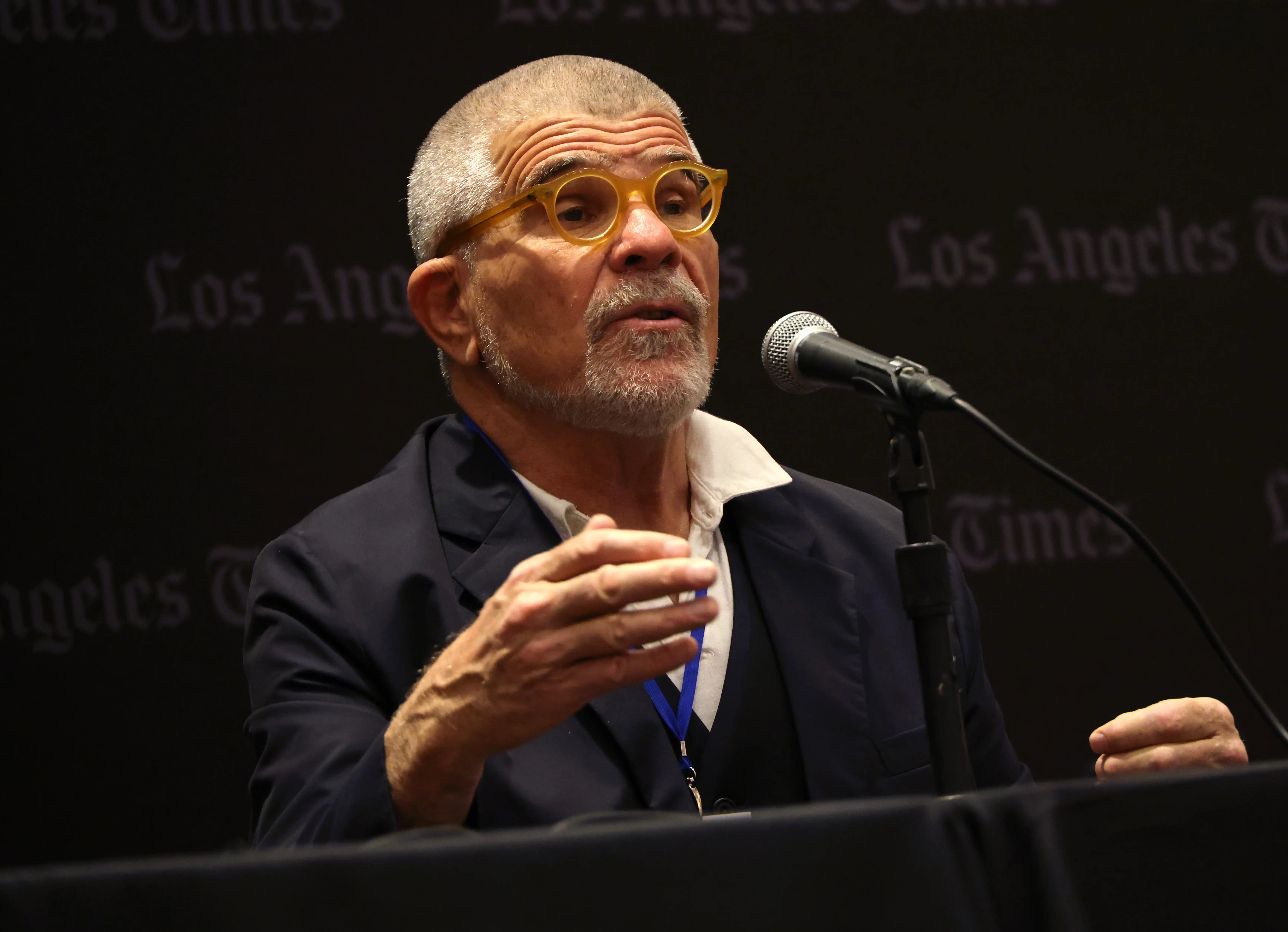 David Mamet speaking into a microphone