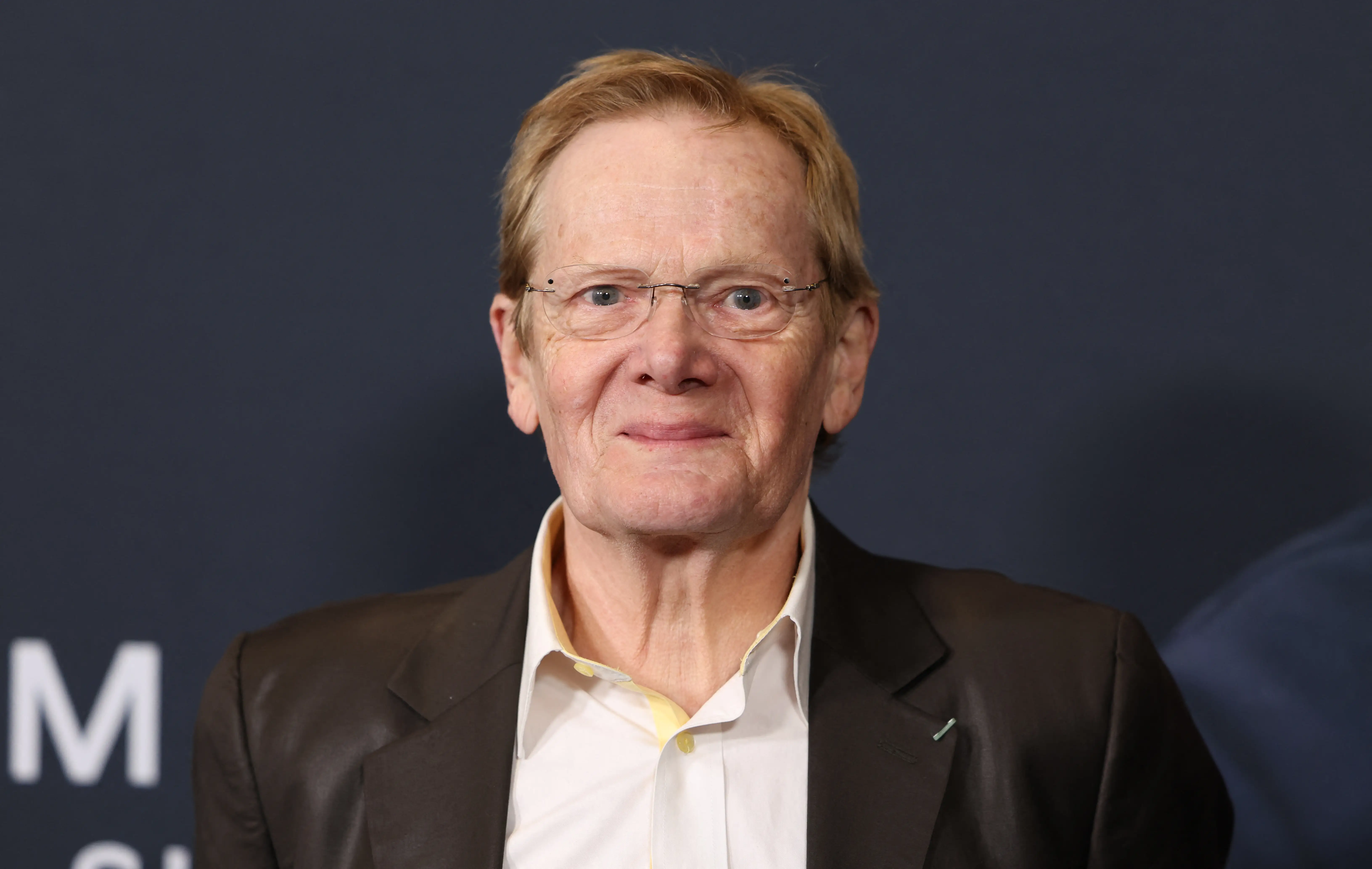 Philippe Petit in a dark suit