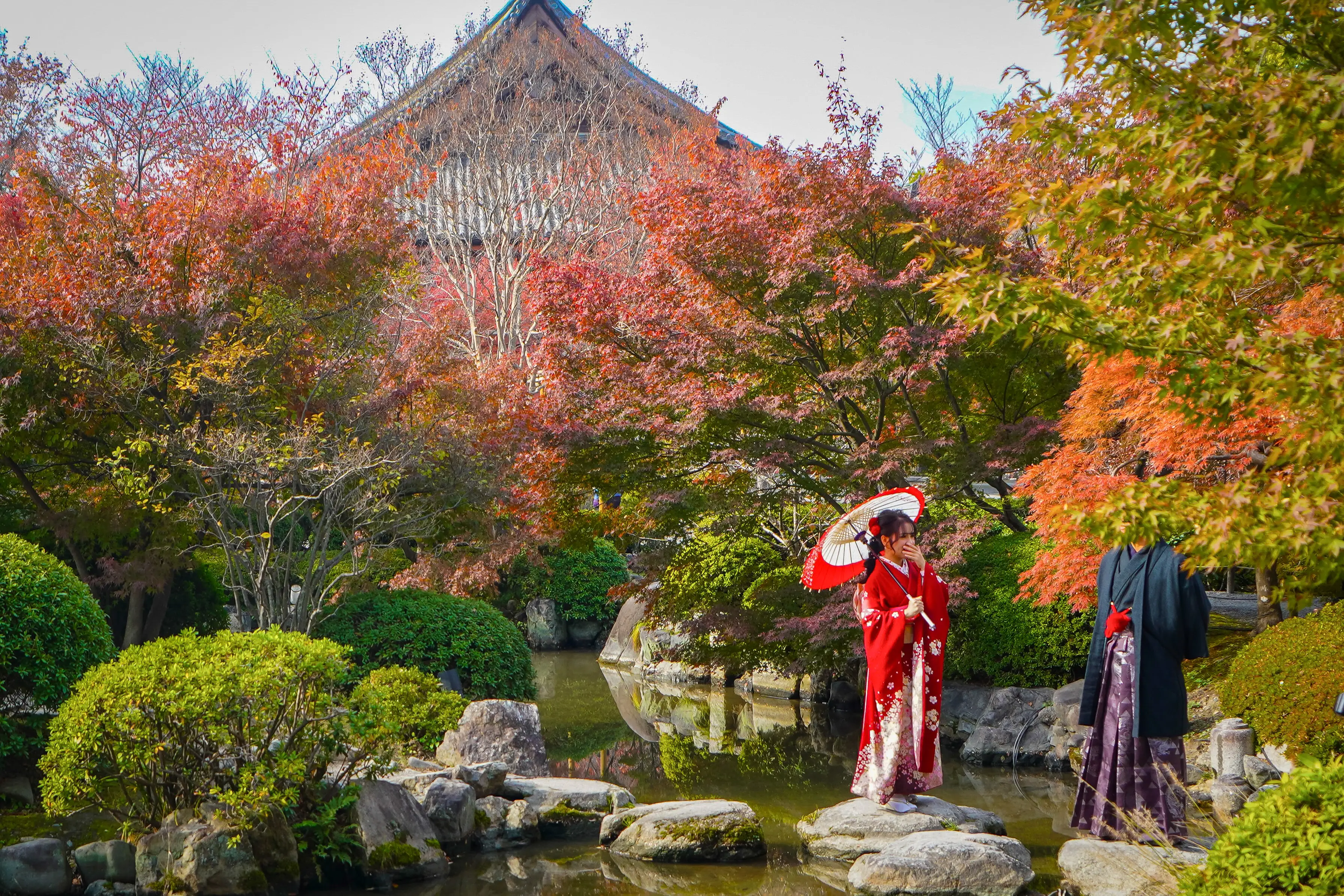 Japanese traditional garments worn in front of To-ji temple in Kyoto, Japan.