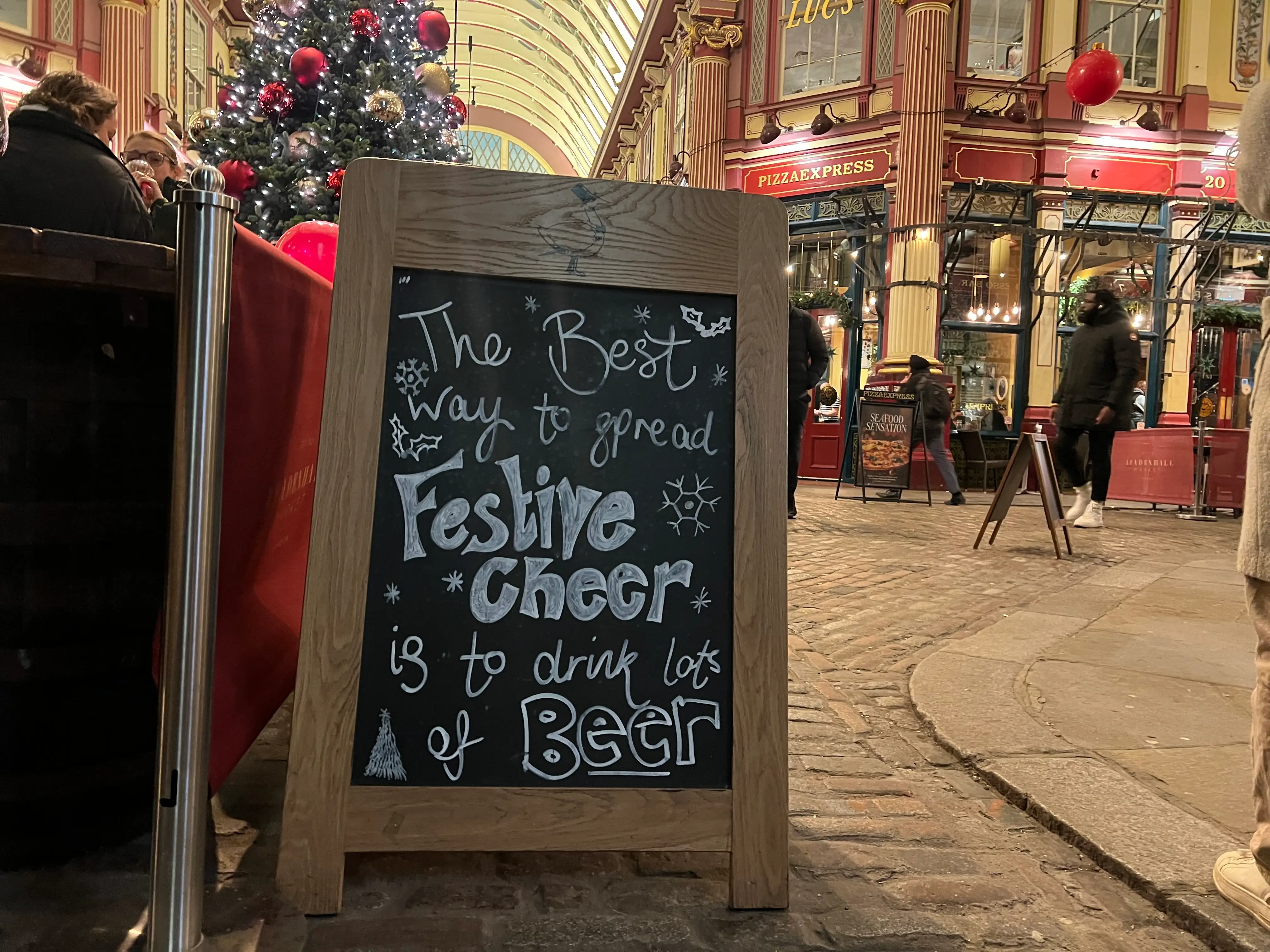 A sign outside a pub reads 