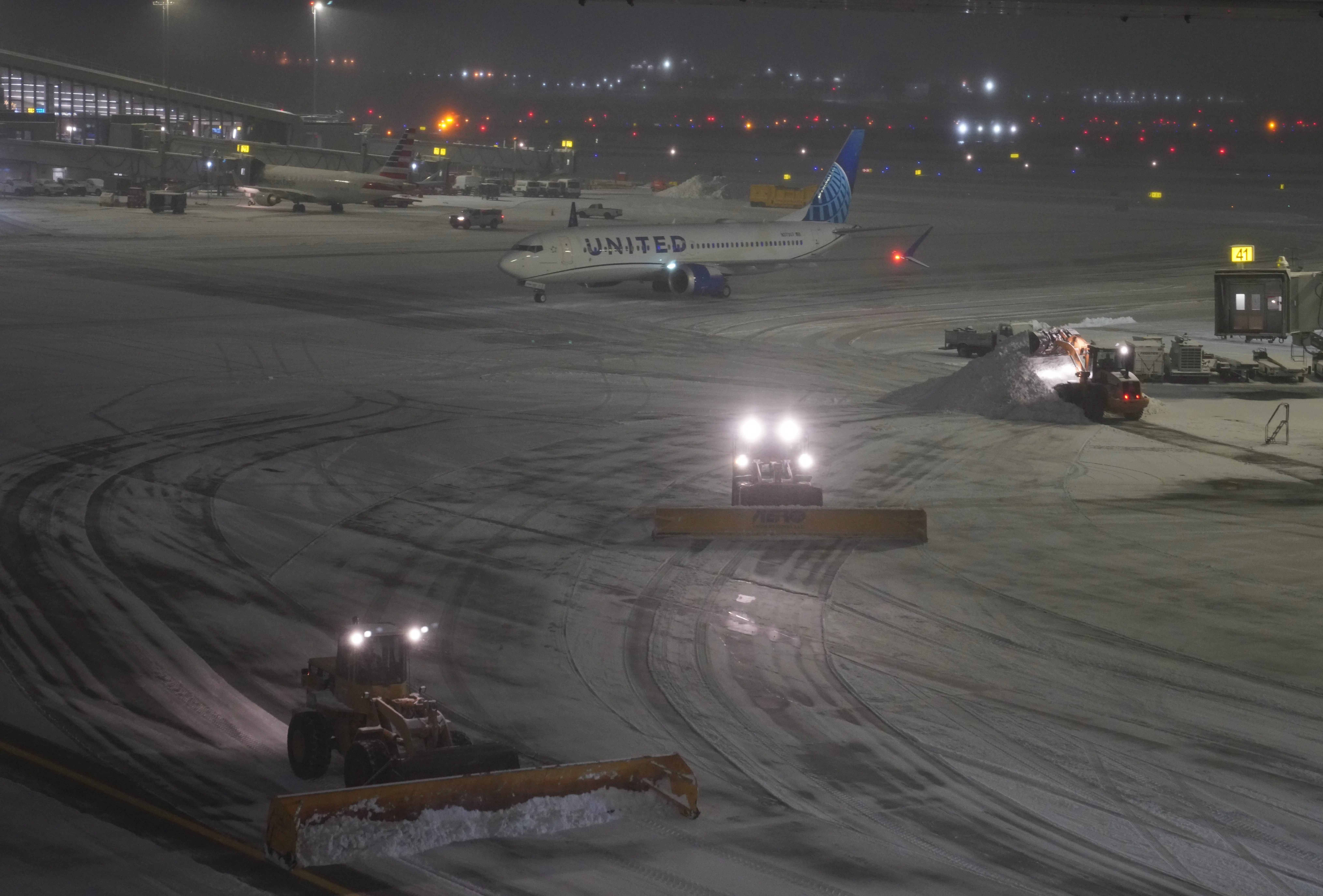 Snowplows clear snow at LaGuardia Airport in New York, the United States, on Dec. 26, 2025. A snowstorm hitting New York on Friday, which has caused flight delays and cancellations.