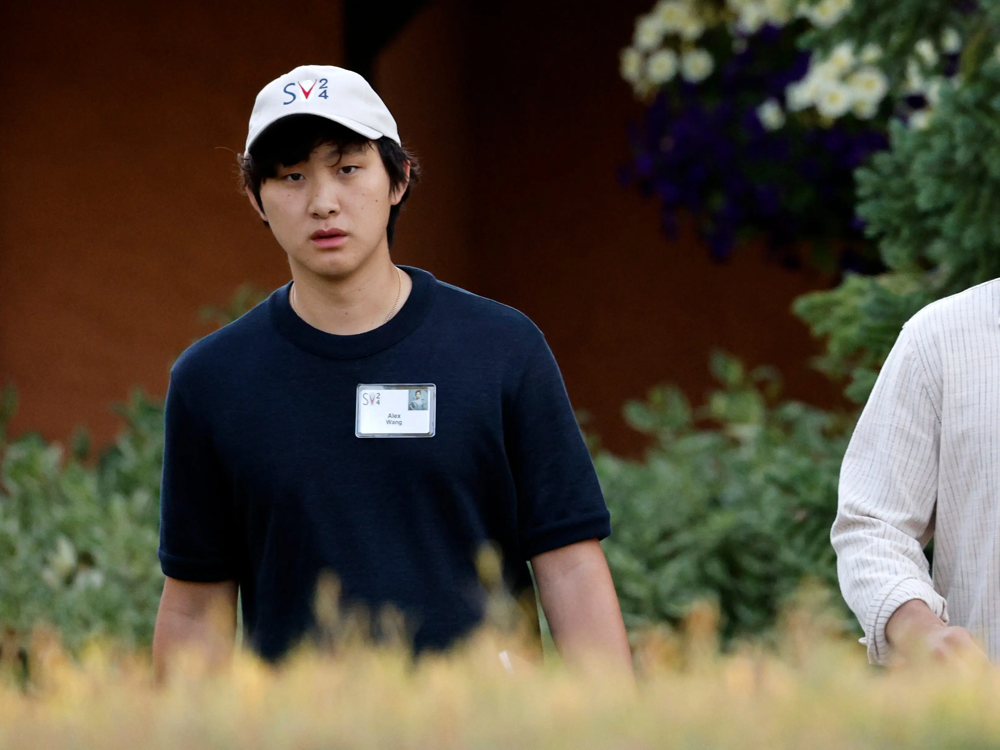 Alexandr Wang, founder and CEO of Scale AI, and Zodi Chalat attend the Allen & Company Sun Valley Conference on July 11, 2024 in Sun Valley, Idaho.