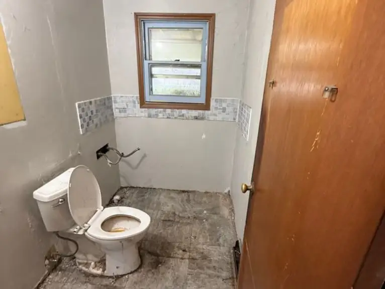 A dirty bathroom in a home.