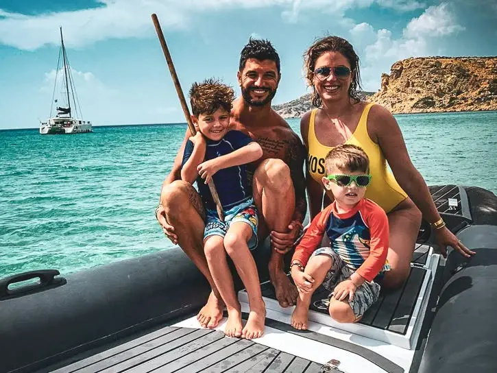 A family of four on a dinghy