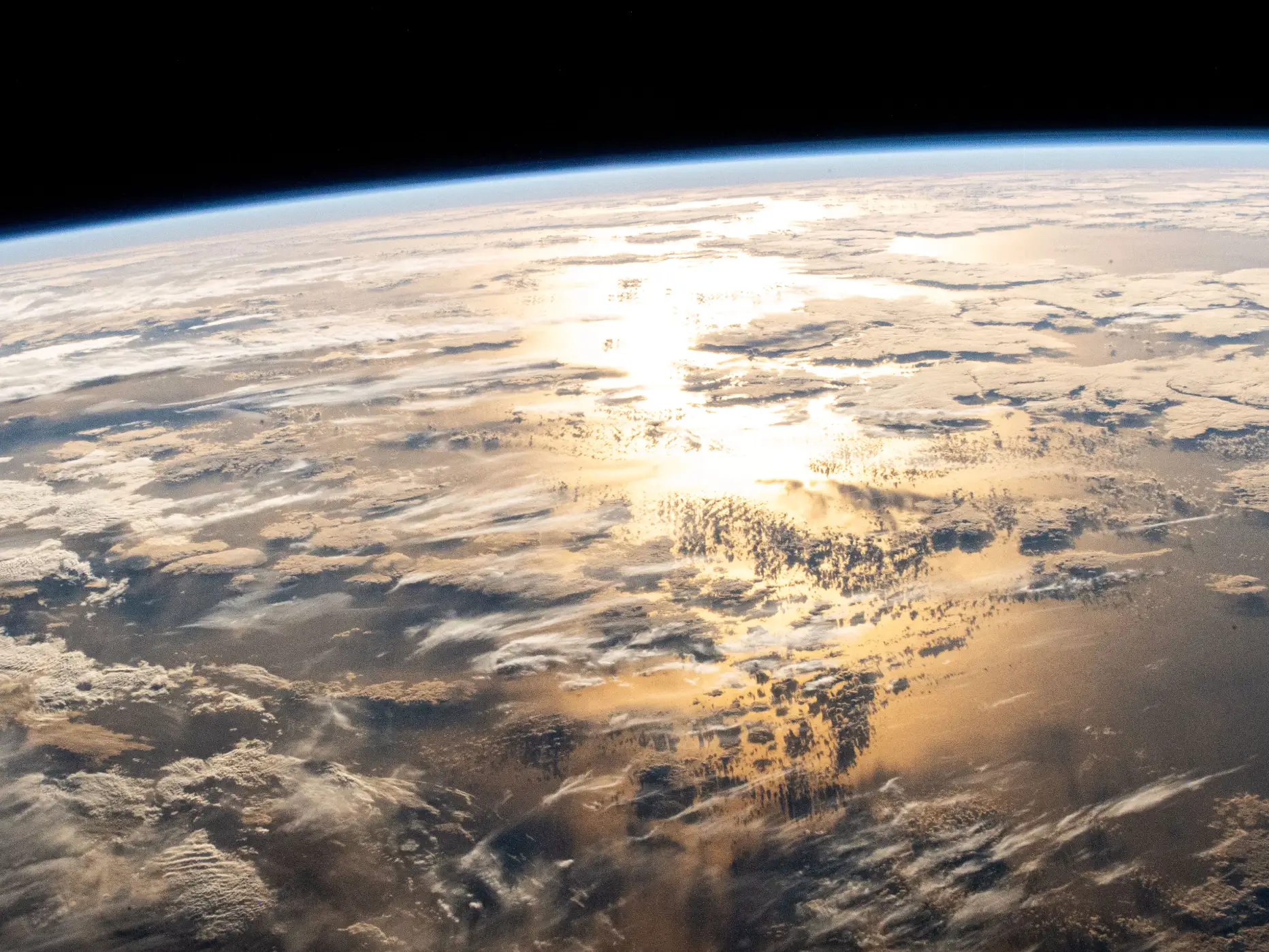 Sunshine bounces of the Atlantic Ocean. as seen from the ISS, in March 2025.