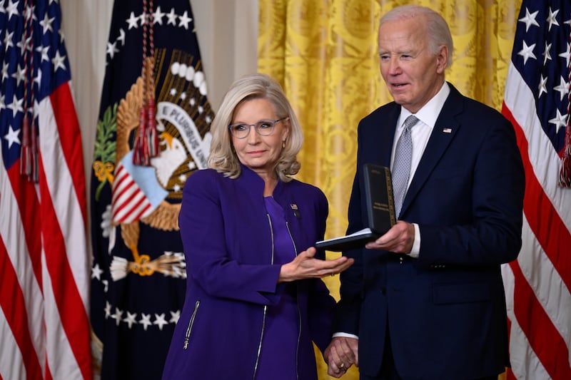 President Joe Biden presents former Rep. Liz Cheney the Presidential Citizens Medal during a ceremony in the East Room at the White House in Washington, D.C.