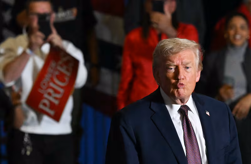US President Donald Trump gestures to the crowd after speaking at a political rally in Rocky Mount, North Carolina on December 19, 2025. (Photo by ANDREW CABALLERO-REYNOLDS / AFP via Getty Images)