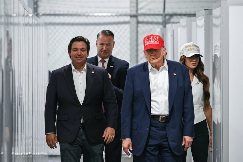 President President Donald Trump, Florida Governor Ron DeSantis, and Homeland Security Secretary Kristi Noem tour “Alligator Alcatraz,” a new migrant detention center in a reptile-infested Florida swamp.