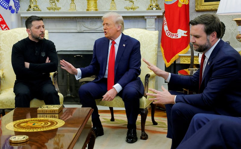 Donald Trump and JD Vance raise their hands while speaking with the Ukraine’s Volodymyr Zelensky.