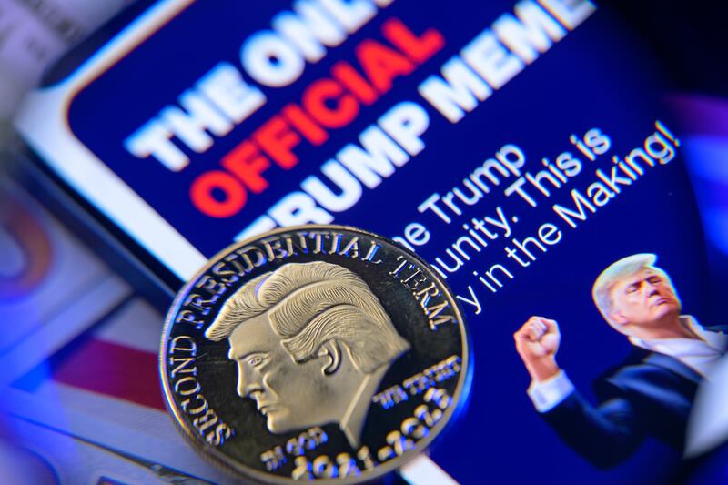 This photo illustration shows the representation of the $Trump meme coin in Brussels, Belgium, on February 13, 2025. (Photo by Jonathan Raa/NurPhoto via Getty Images)