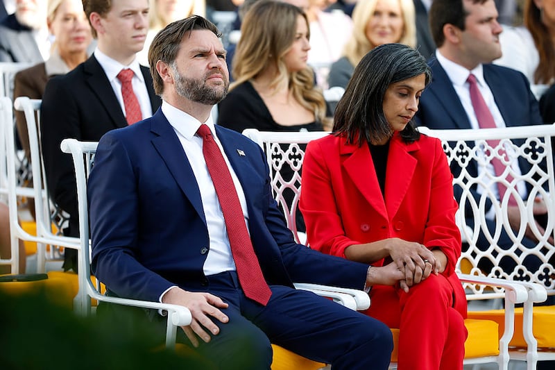 U.S. Vice President JD Vance (L) sits with his wife Usha Vance prior to a Presidential Medal of Freedom ceremony in the Rose Garden of the White House on October 14, 2025 in Washington, DC.