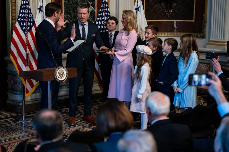 WASHINGTON, DC - JANUARY 25: U.S. Vice President J.D. Vance ceremonially swears in newly confirmed Secretary of Defense Pete Hegseth while Hegseth's wife, Jennifer Rauchet, and their seven children look on, during a swearing-in ceremony in the Indian Treaty Room at the Eisenhower Executive Office Building on January 25, 2025 in Washington, DC. The Senate confirmed Pete Hegseth as Defense secretary in a 51-50 vote, with Vice President J.D. Vance breaking the tie after three Republicans joined Democrats in opposition  the second time in history that a vice president has broken a tie for a Cabinet nominee. The first was Betsy DeVos in 2017.