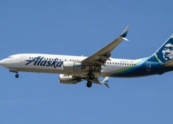 Out-of-control Alaska Airlines passenger tries to opens plane door mid-flight