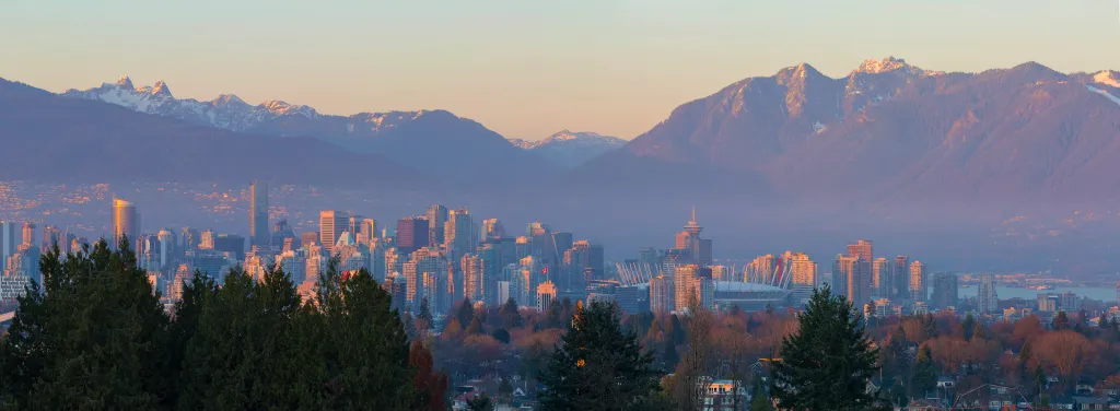 Vancouver British Columbia Canada city skyline and mountain view during sunset panorama