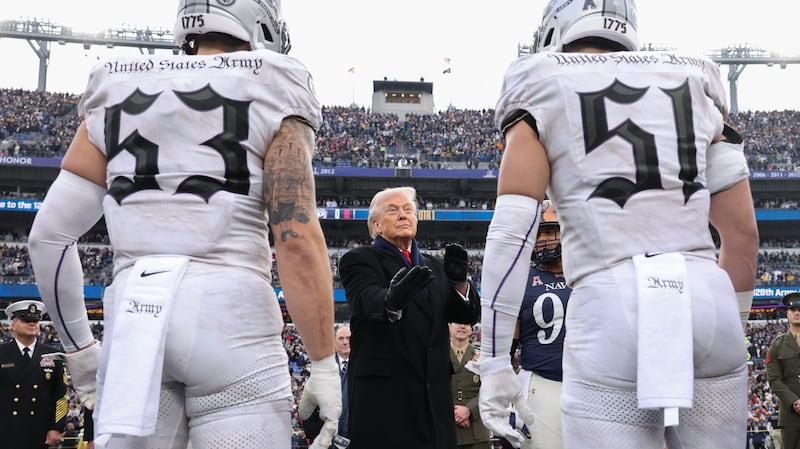 BALTIMORE, MARYLAND - DECEMBER 13: U.S. President Donald Trump participates in the coin toss before the start of the 126th Army-Navy Game between the Army Black Knights and the Navy Midshipmen at M&T Bank Stadium on December 13, 2025 in Baltimore, Maryland. The teams are competing for the Commander-in-Chief's Trophy, with President Trump attending the rivalry for the second consecutive year. (Photo by Tasos Katopodis/Getty Images)