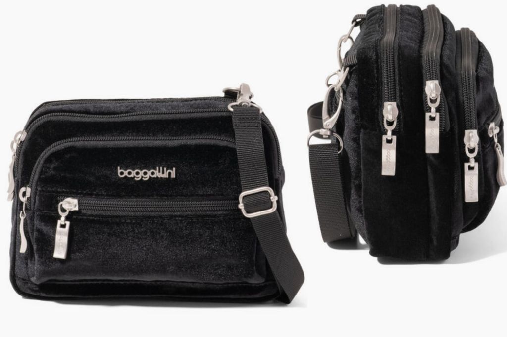 A black crossbody bag from the front and side with gold hardware.