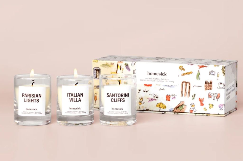 A trio of candles with its gift box.