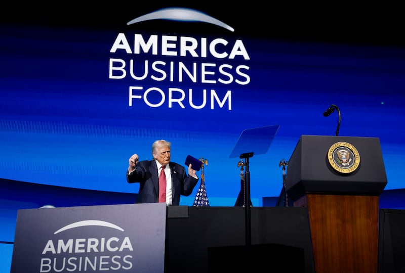 MIAMI, FLORIDA - NOVEMBER 05: U.S. President Donald Trump dances after delivering remarks during the America Business Forum at the Kaseya Center on November 05, 2025 in Miami, Florida. The forum brings together global leaders, cultural figures and innovators from various sectors for discussions on business, technology and social development.