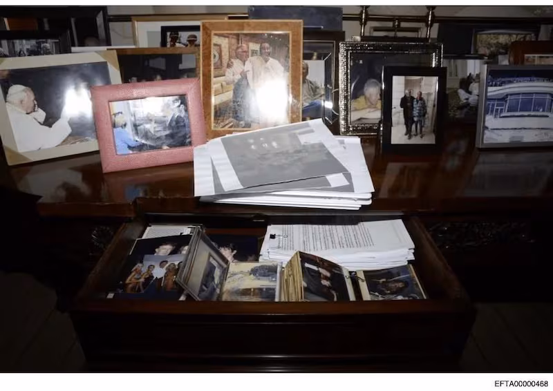 Epstein's desk featuring a picture of Trump and Epstein.