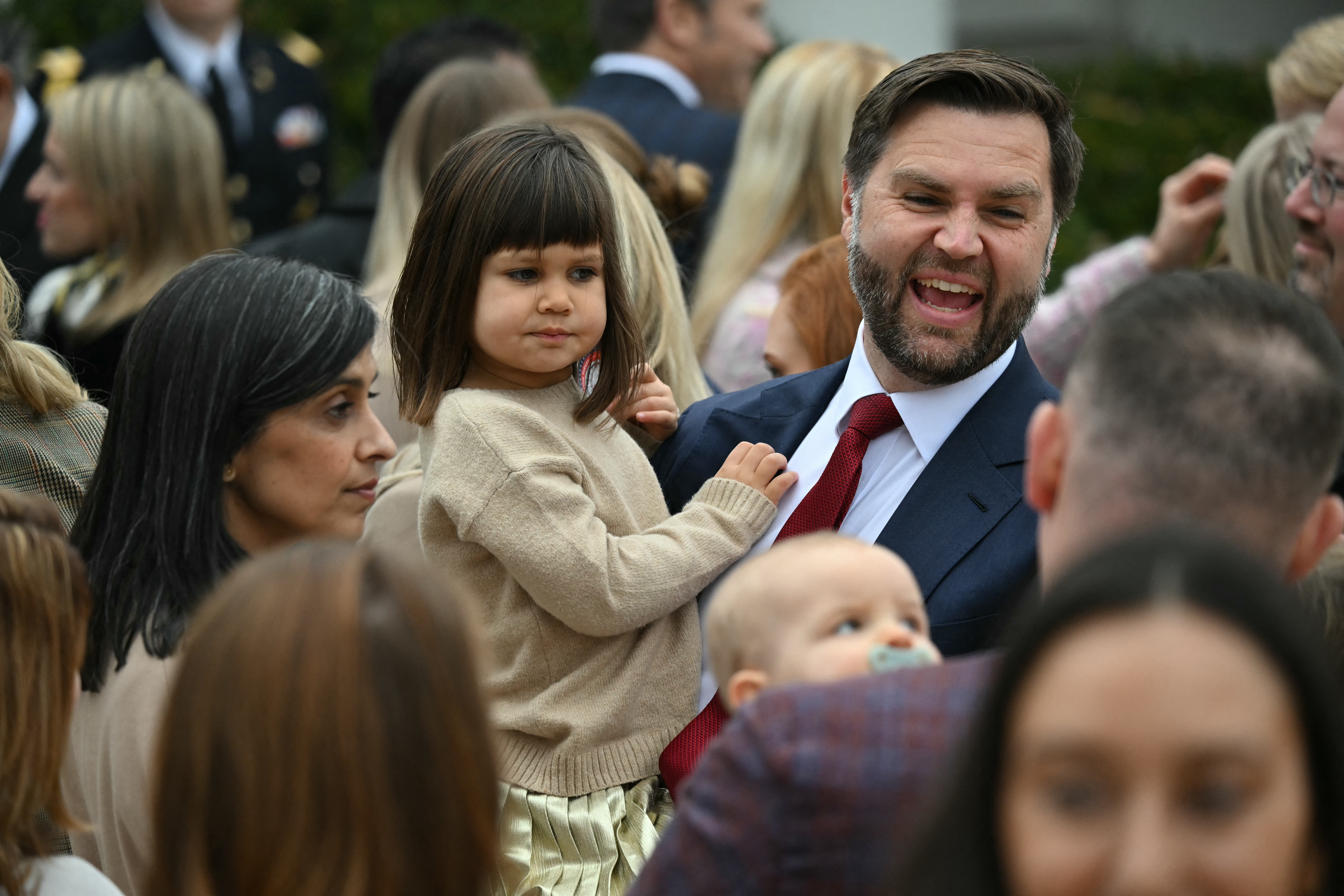 JD US Vice President JD Vance holds his daughter Mirabel as his wife, the Second Lady Usha Vance looks on after US President Donald Trump pardoned Gobble, one of the National Thanksgiving turkeys, during the turkey pardon ceremony in the Rose Garden of the White House in Washington, DC on November 25, 2025.